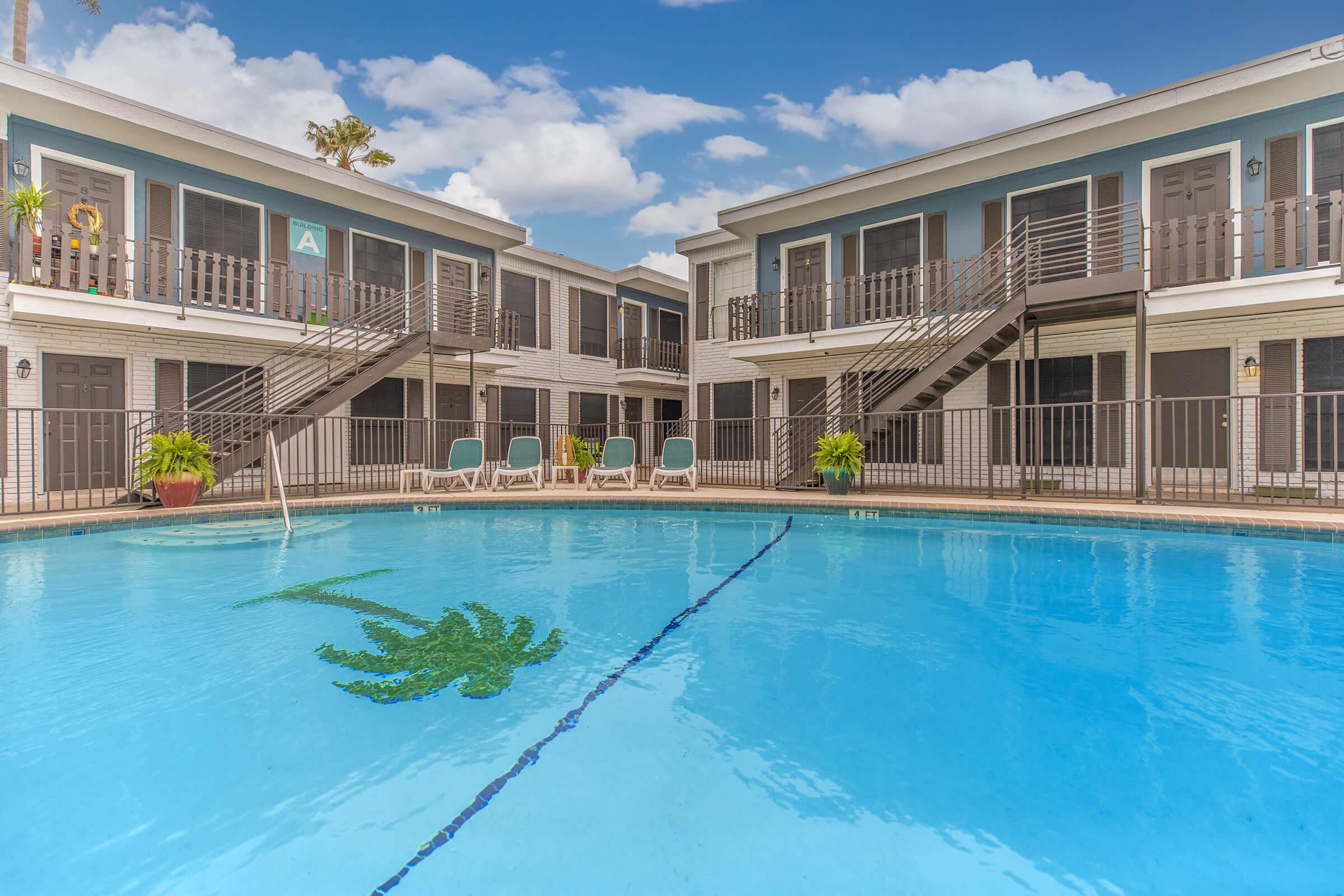 a large pool of water in front of a building