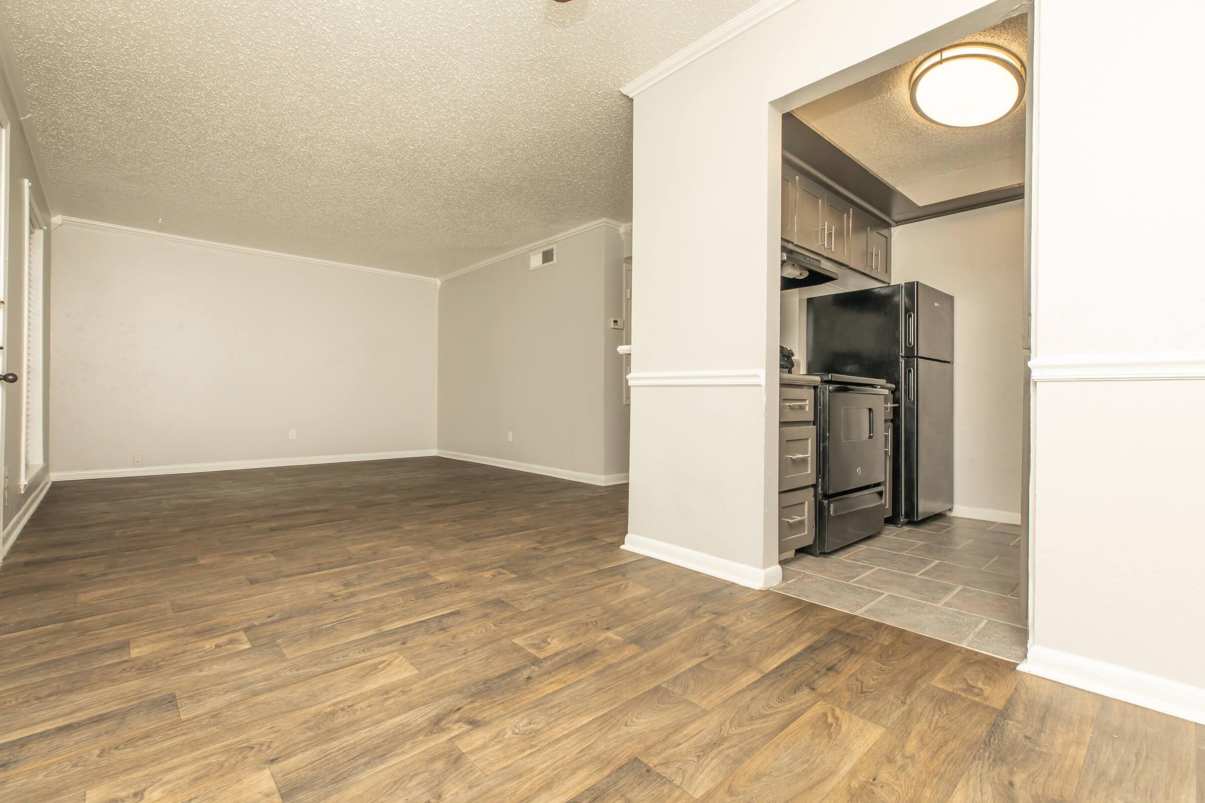 a kitchen with a sink and a refrigerator