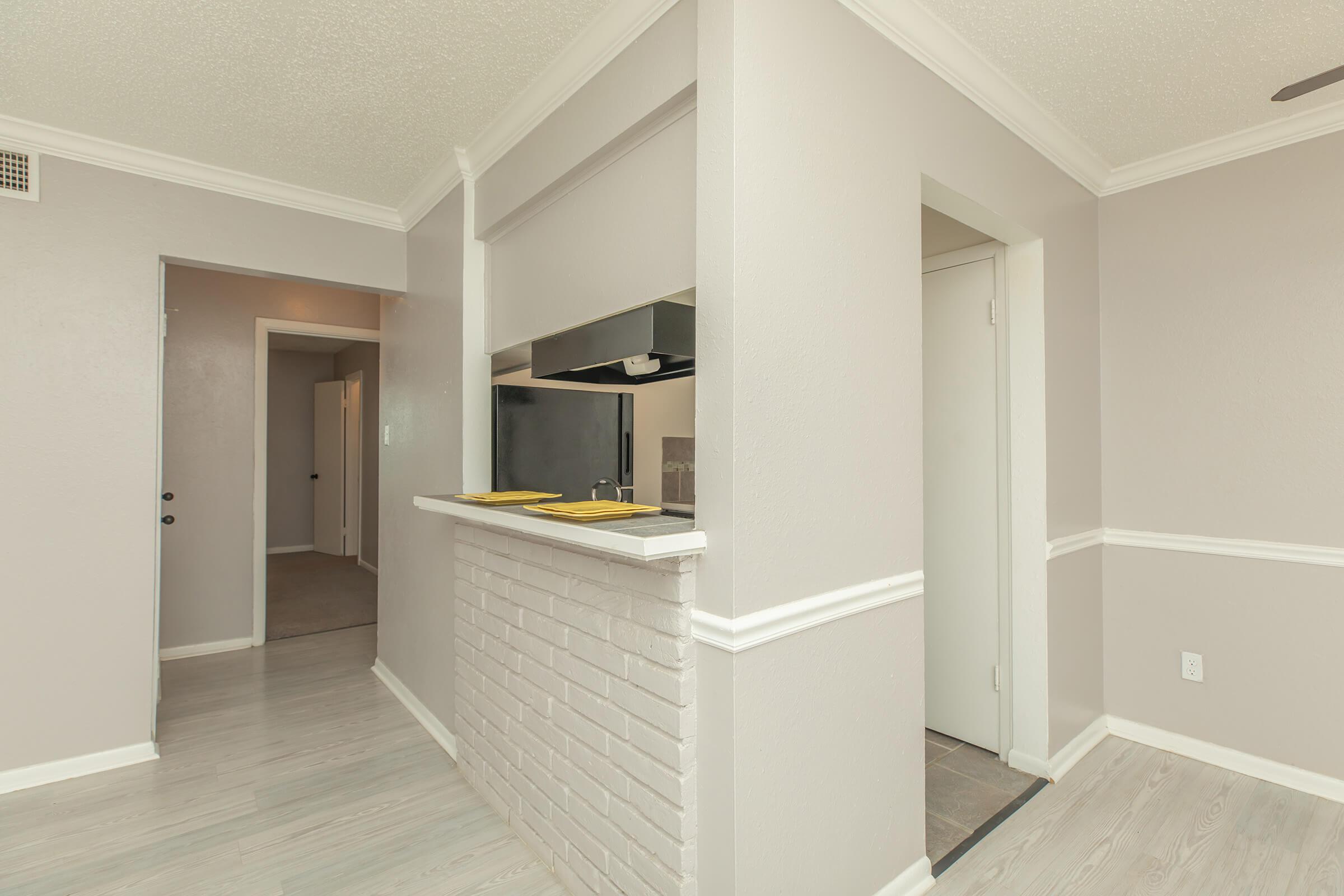 a kitchen area with a building in the background