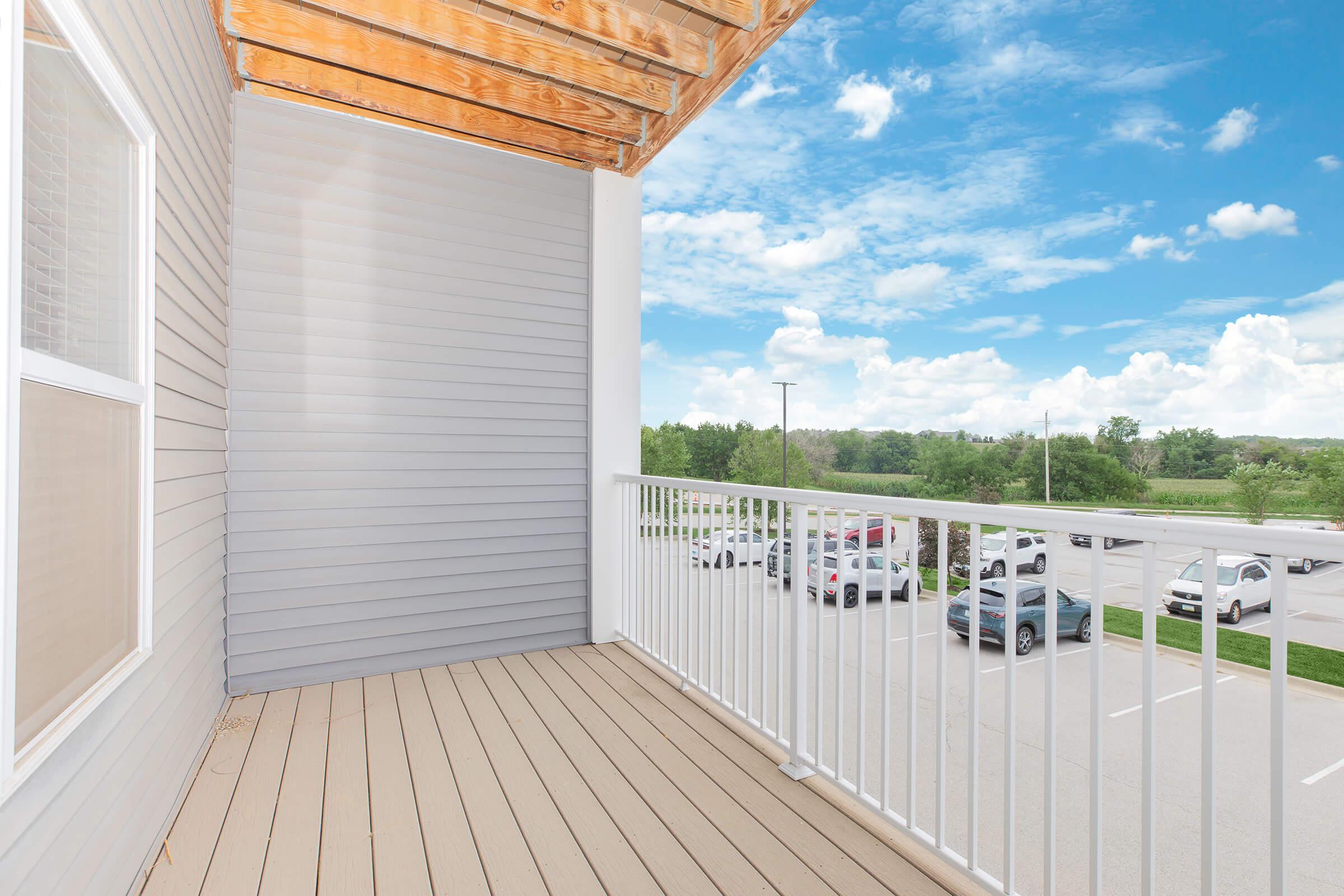 Private balcony with outdoor views at The Groves on Devils Glen in Bettendorf, IA Pleasant Valley School District