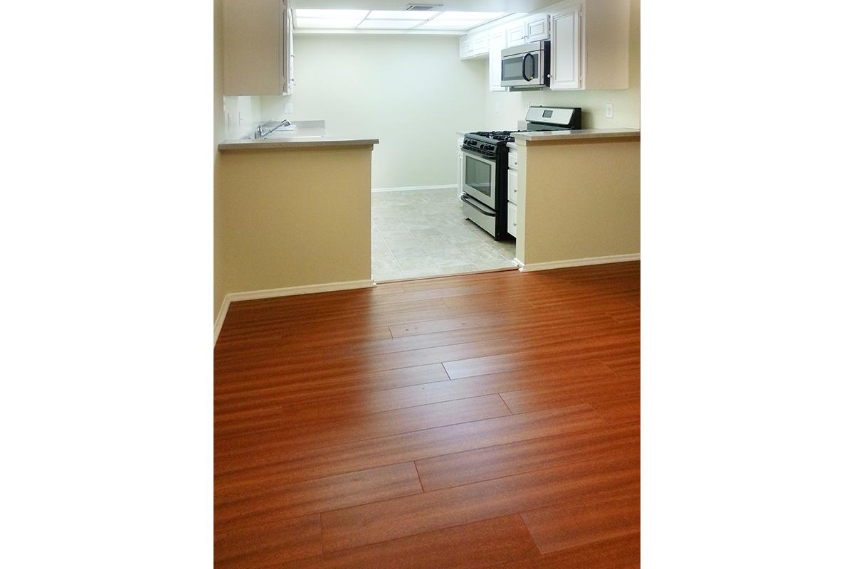 a kitchen with a wood floor