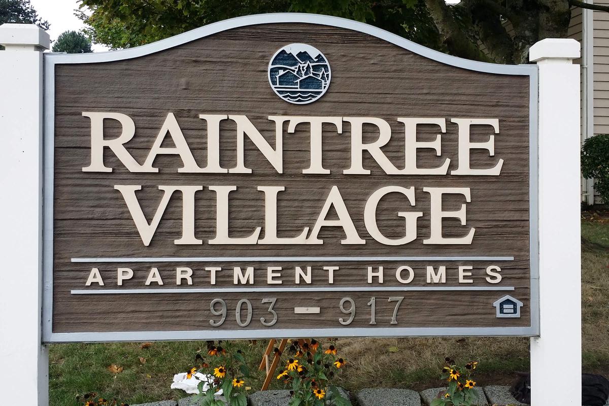 a sign in front of a house