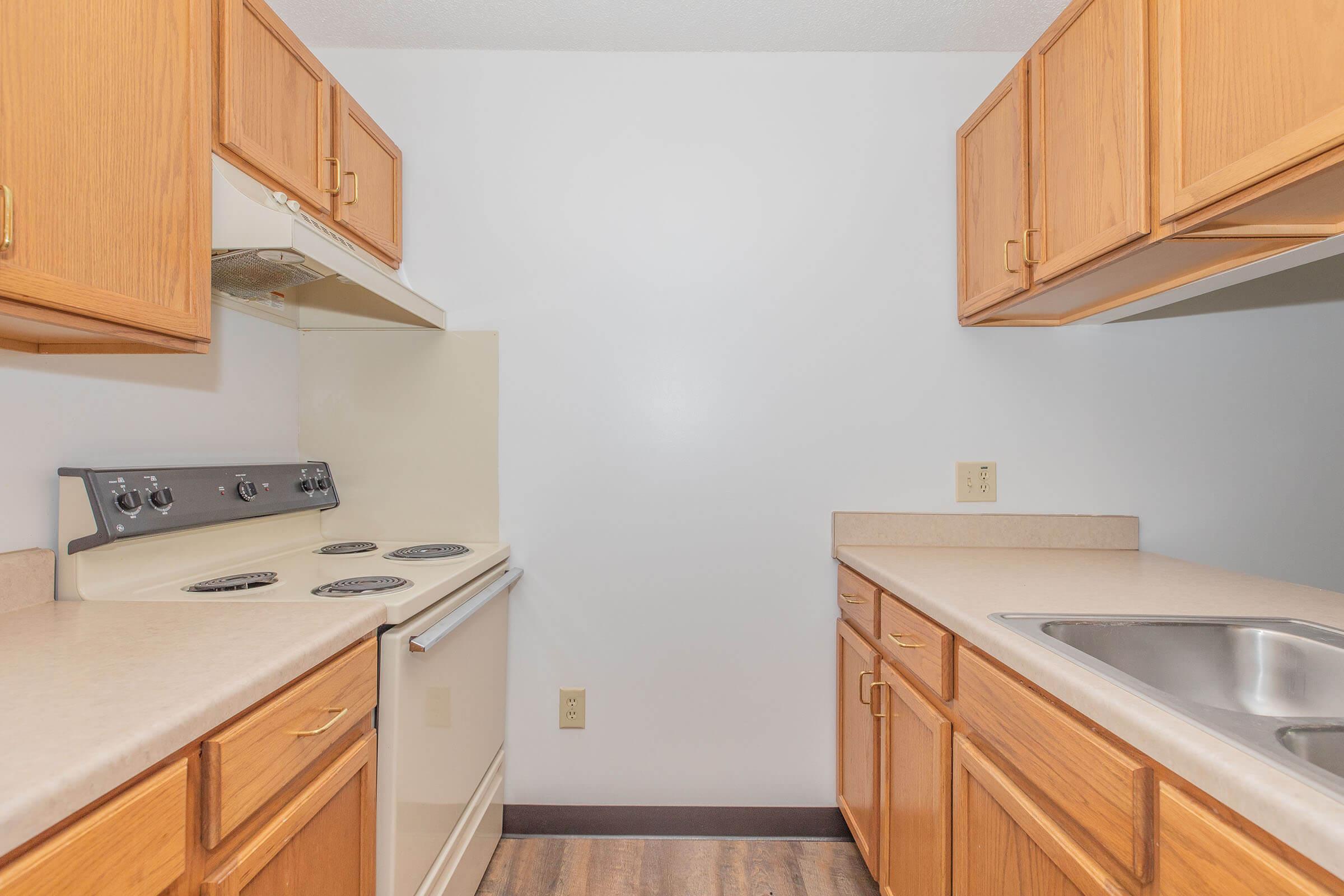 a kitchen with a stove and a sink