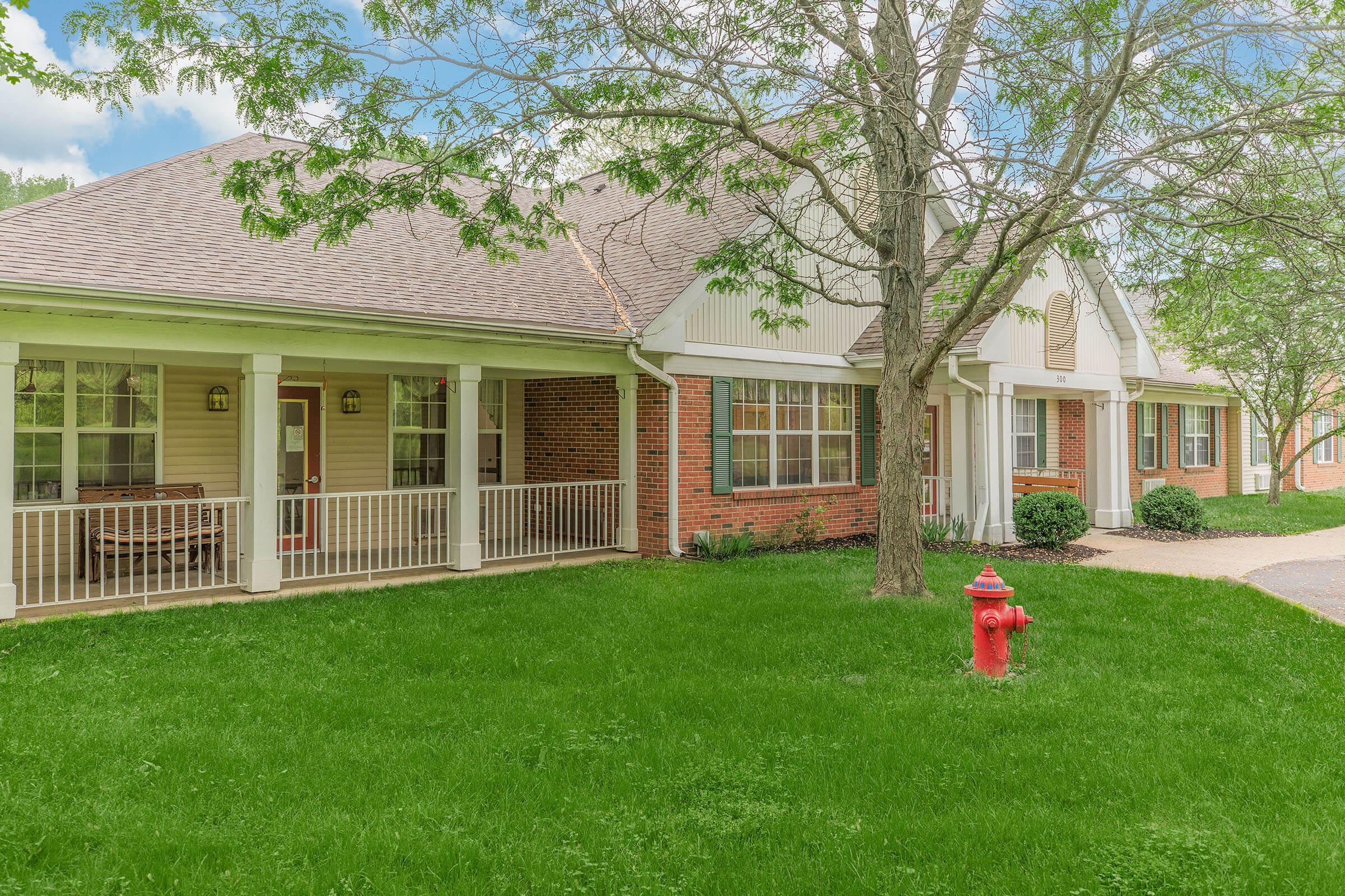 a fire hydrant in front of a house