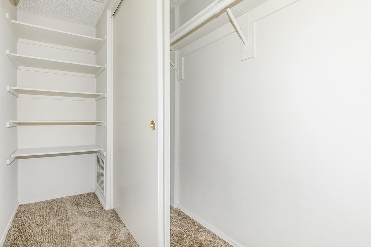 Open sliding closet door and hallway shelves