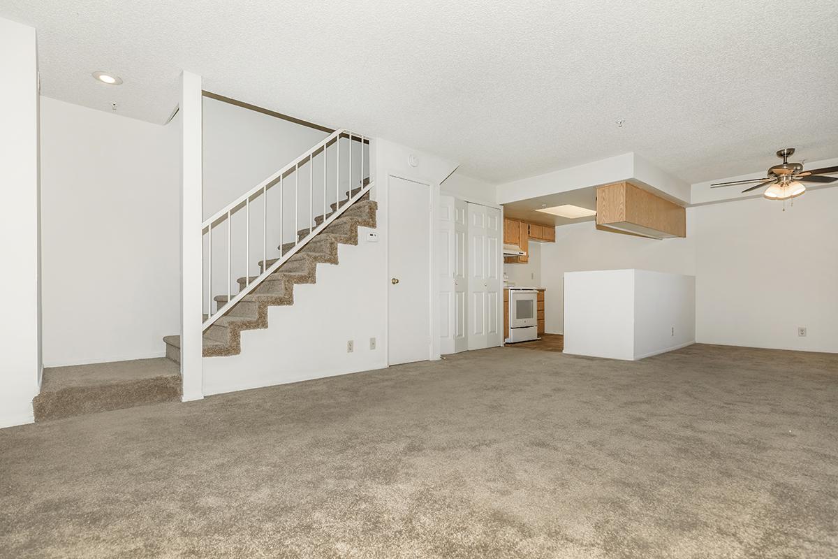 Carpeted living room and stairs