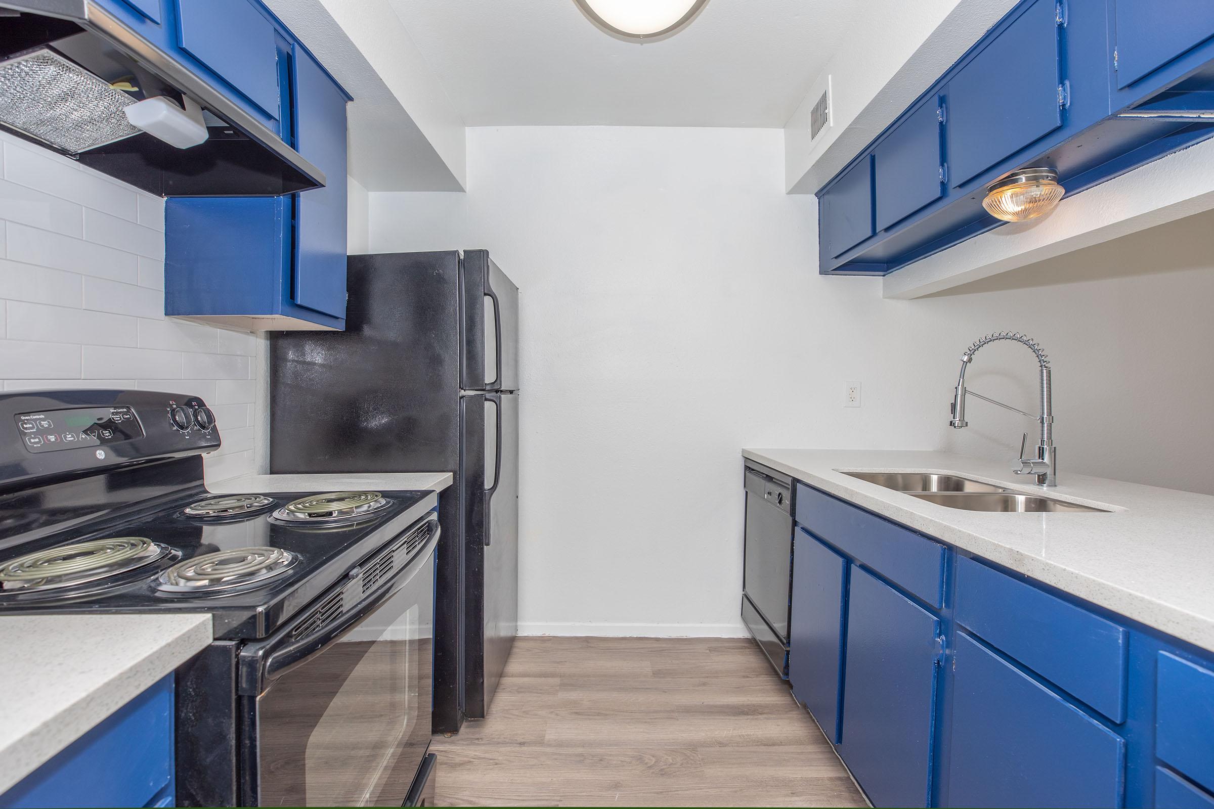 a kitchen with a stove top oven