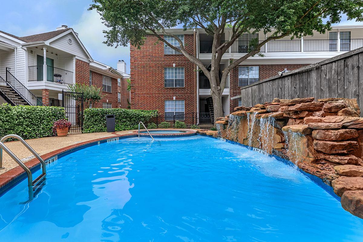 a house with a large pool of water