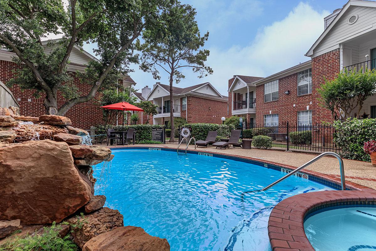 a house with a large pool of water