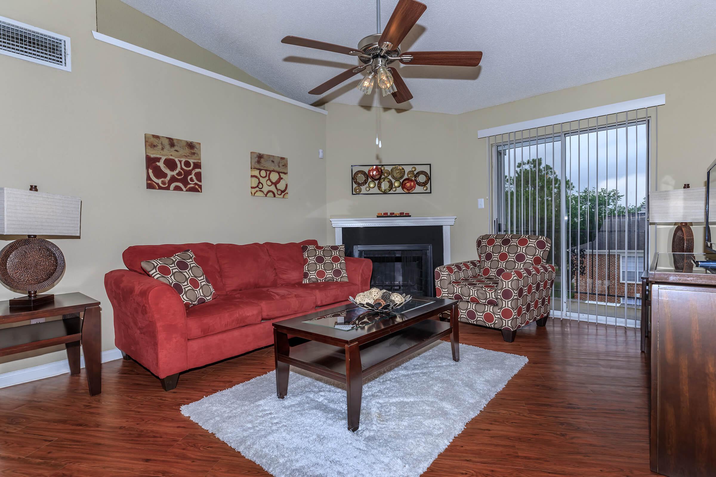 a living room filled with furniture and a fireplace