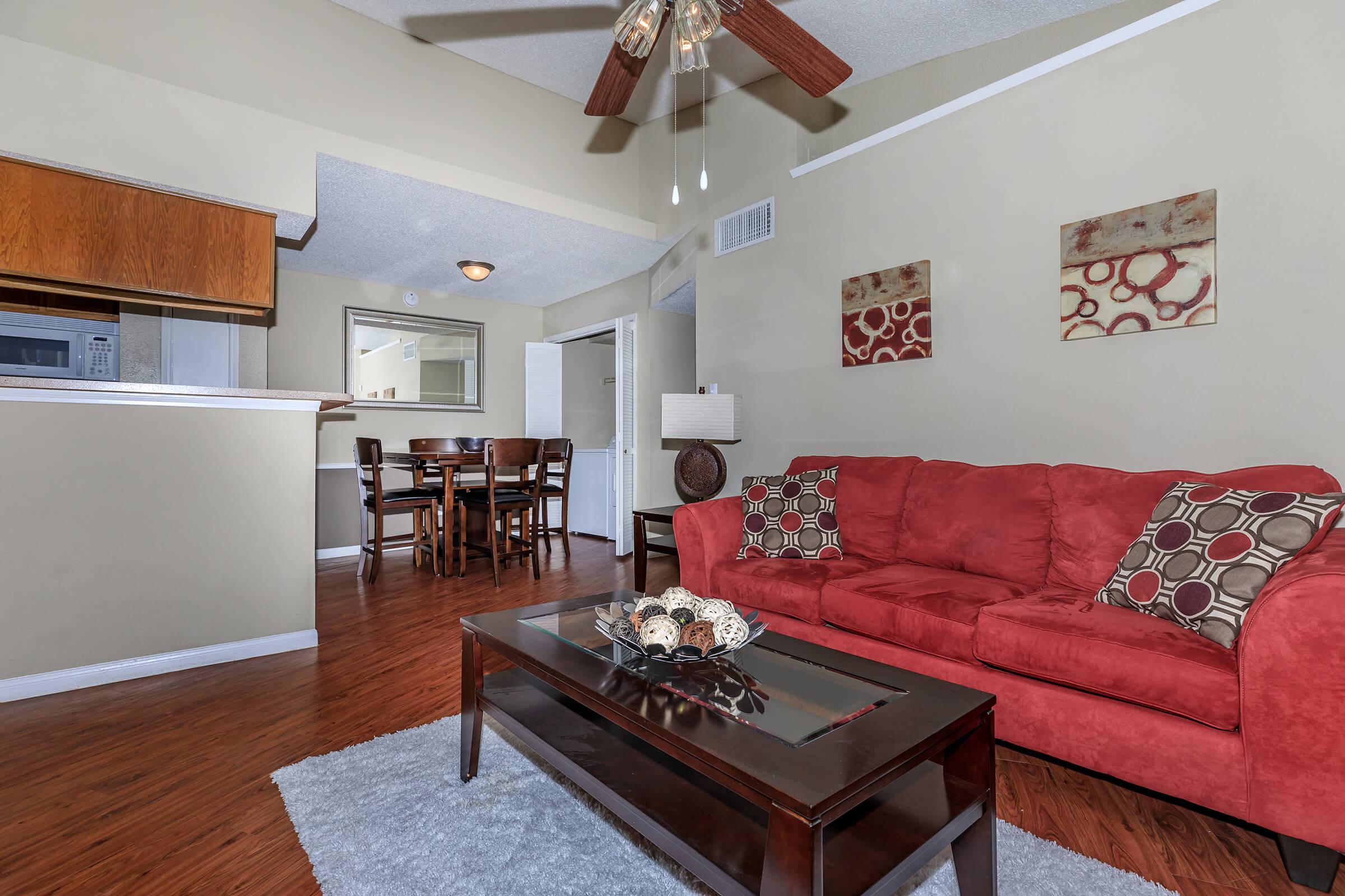 a living room with red floor