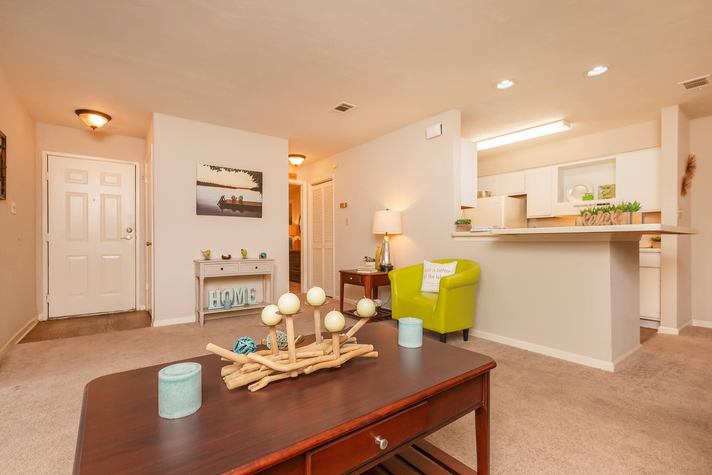 a living room with a sink and a mirror