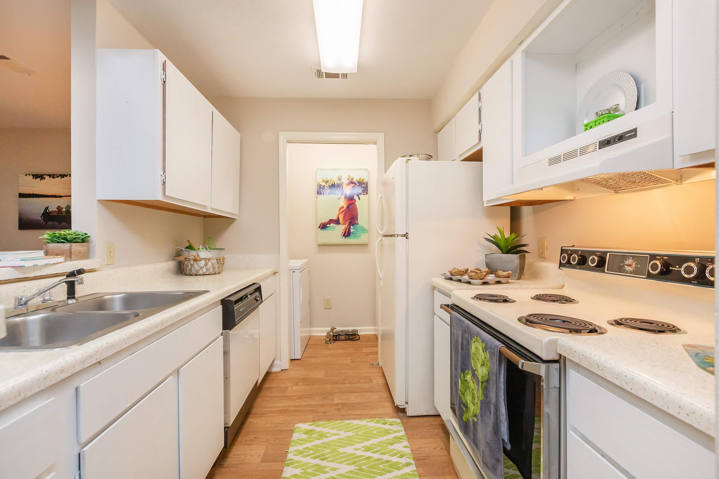 a kitchen with a stove and a sink