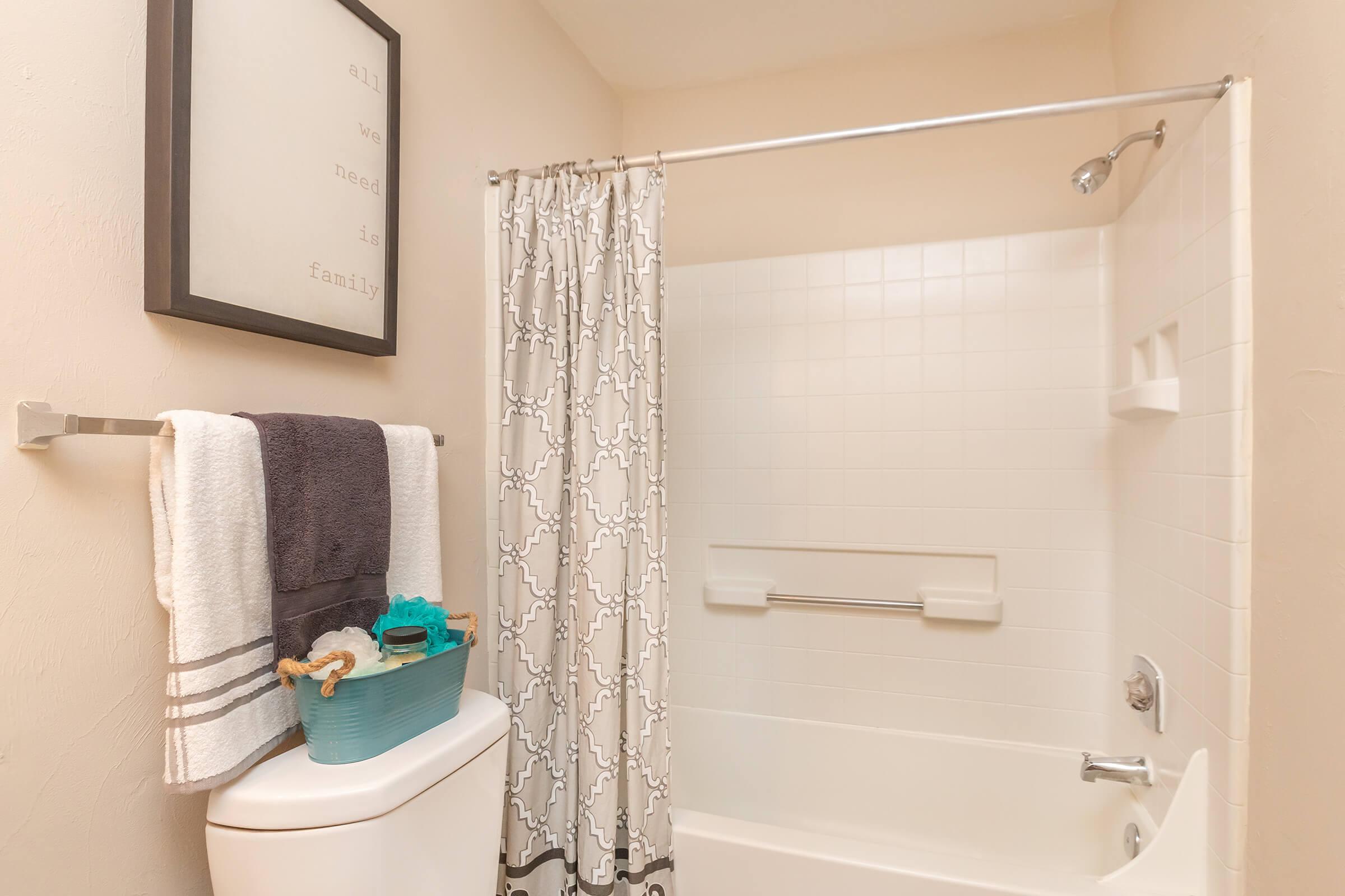 a white tub sitting next to a shower