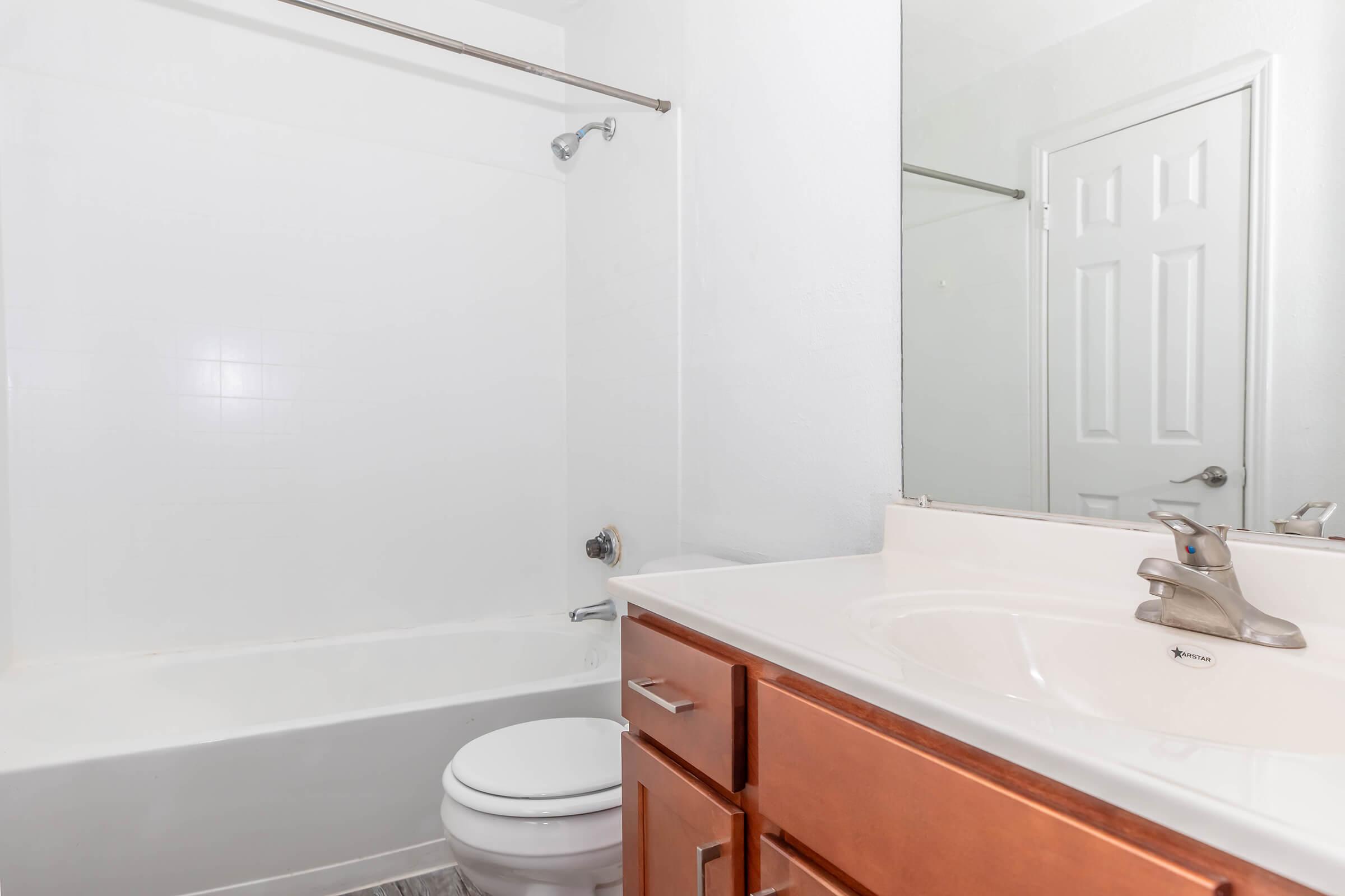 a room with a sink and a bath tub