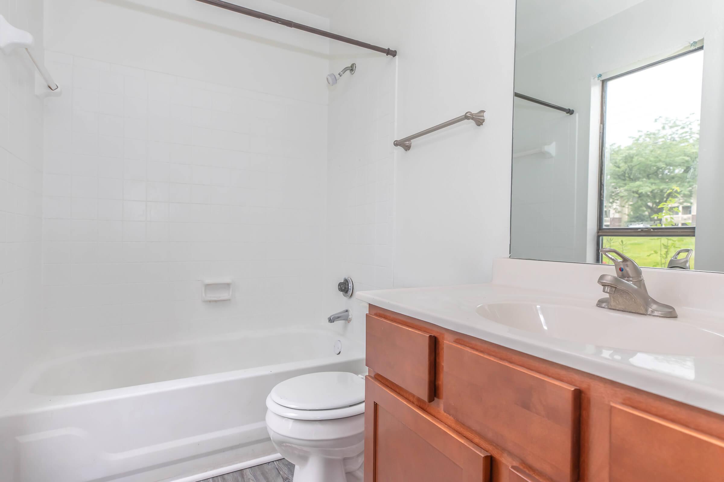 a room with a sink and a shower