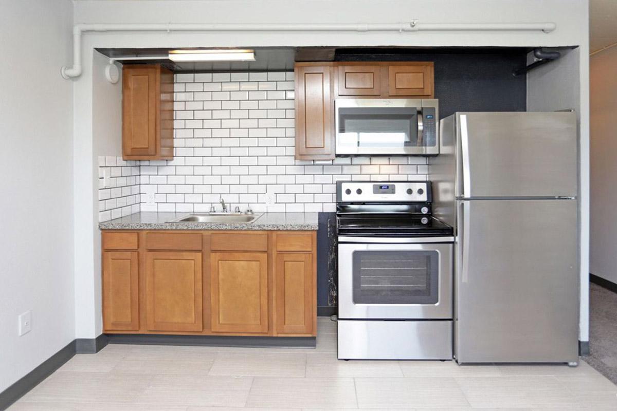 a kitchen with a stove top oven sitting inside of a refrigerator