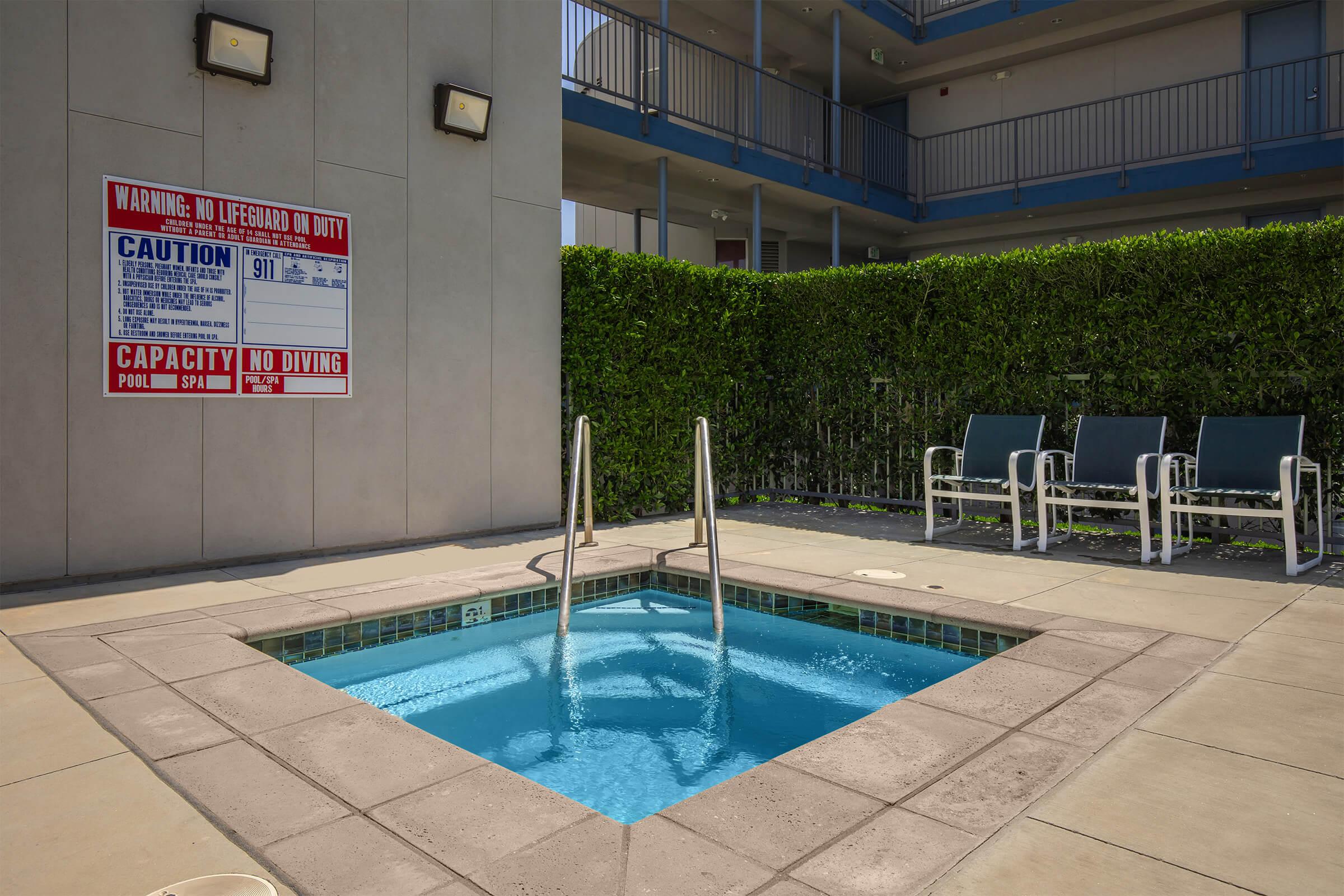 a pool in front of a building