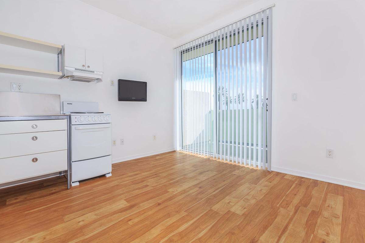 a kitchen with a wood floor