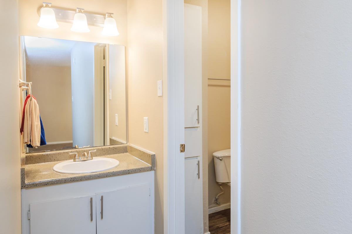 a white sink sitting next to a door