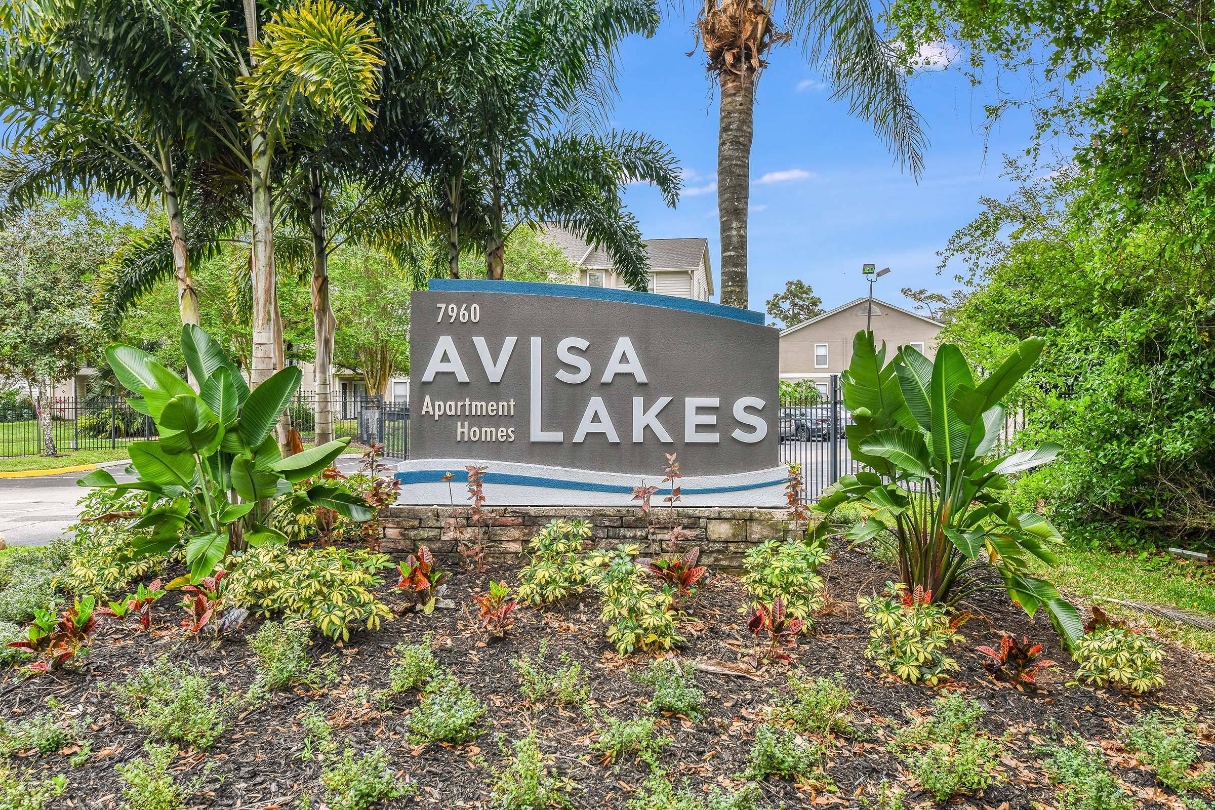 a sign in front of a tree