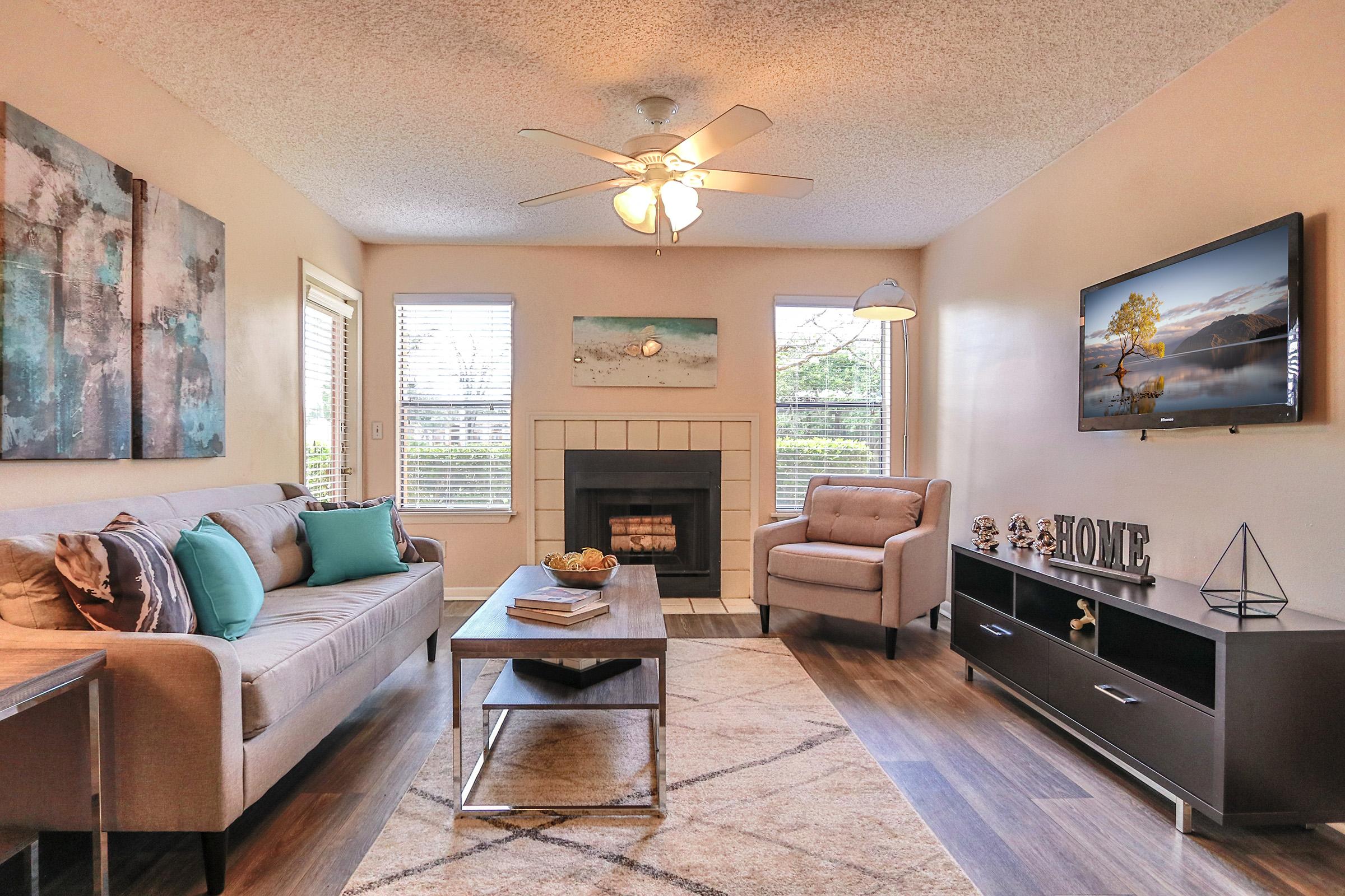 a living room filled with furniture and a fire place