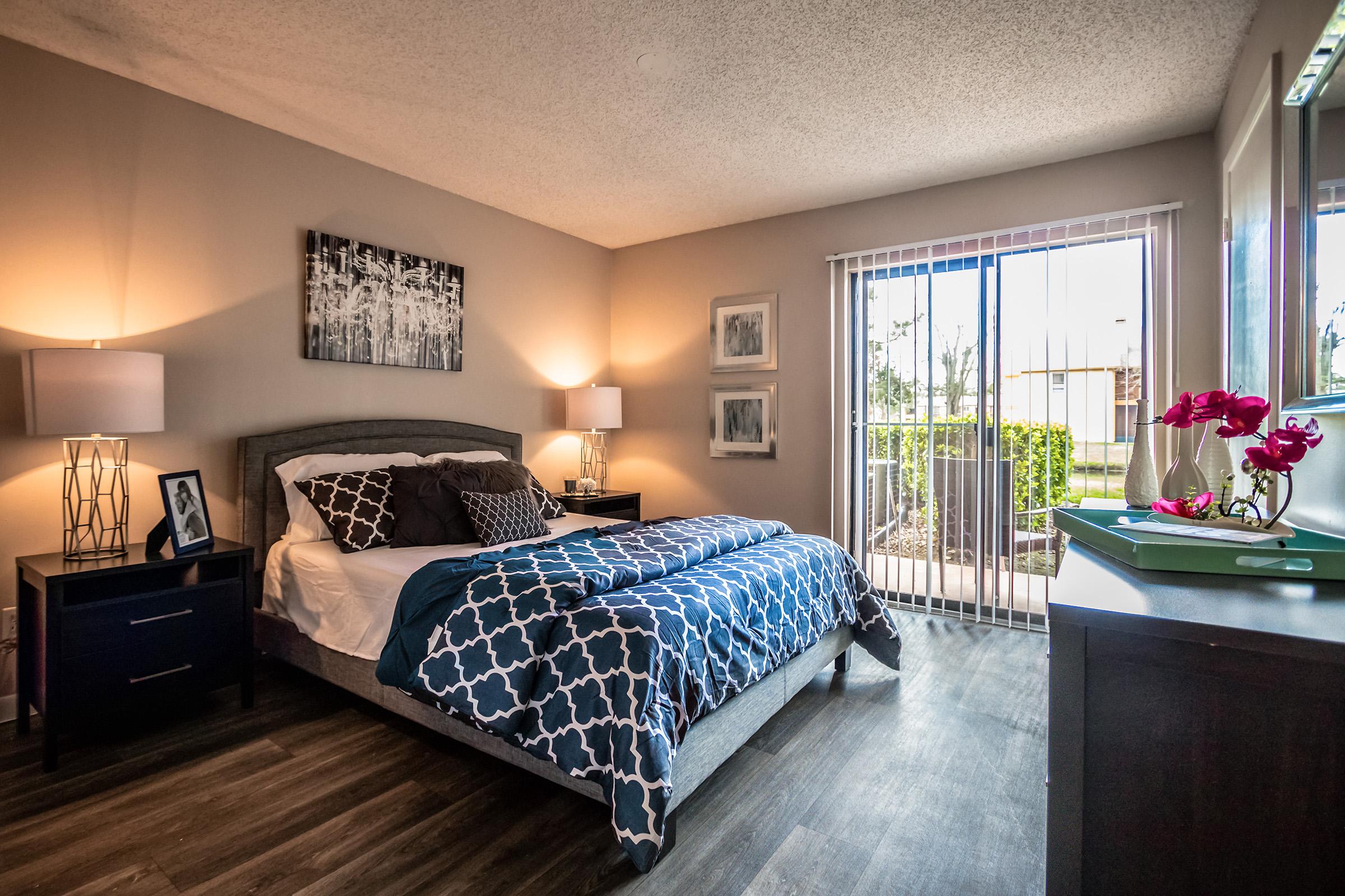 a bedroom with a large bed in a room