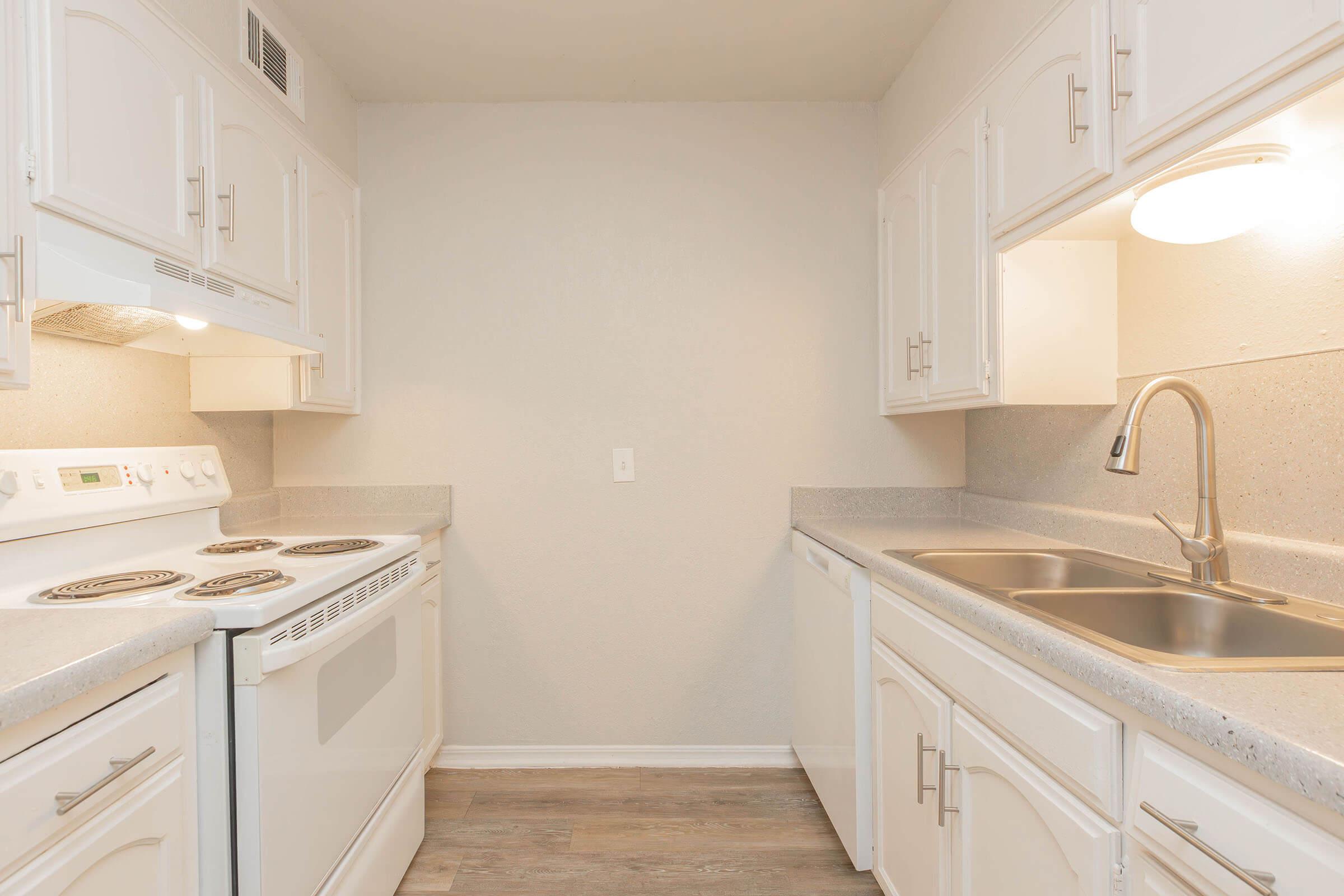 a kitchen with a sink and a microwave