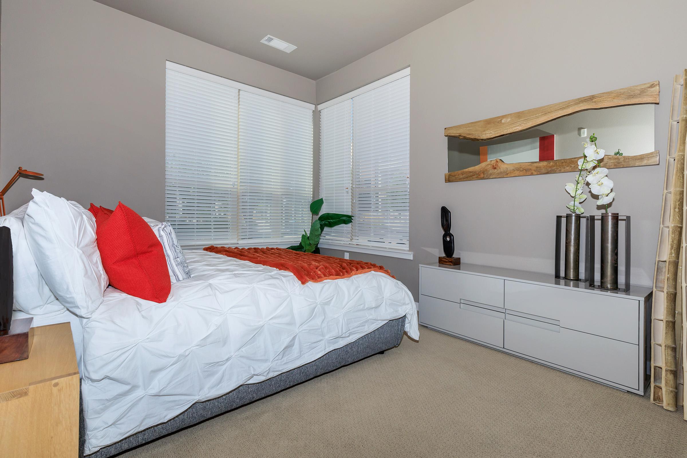 a bedroom with a bed in a room