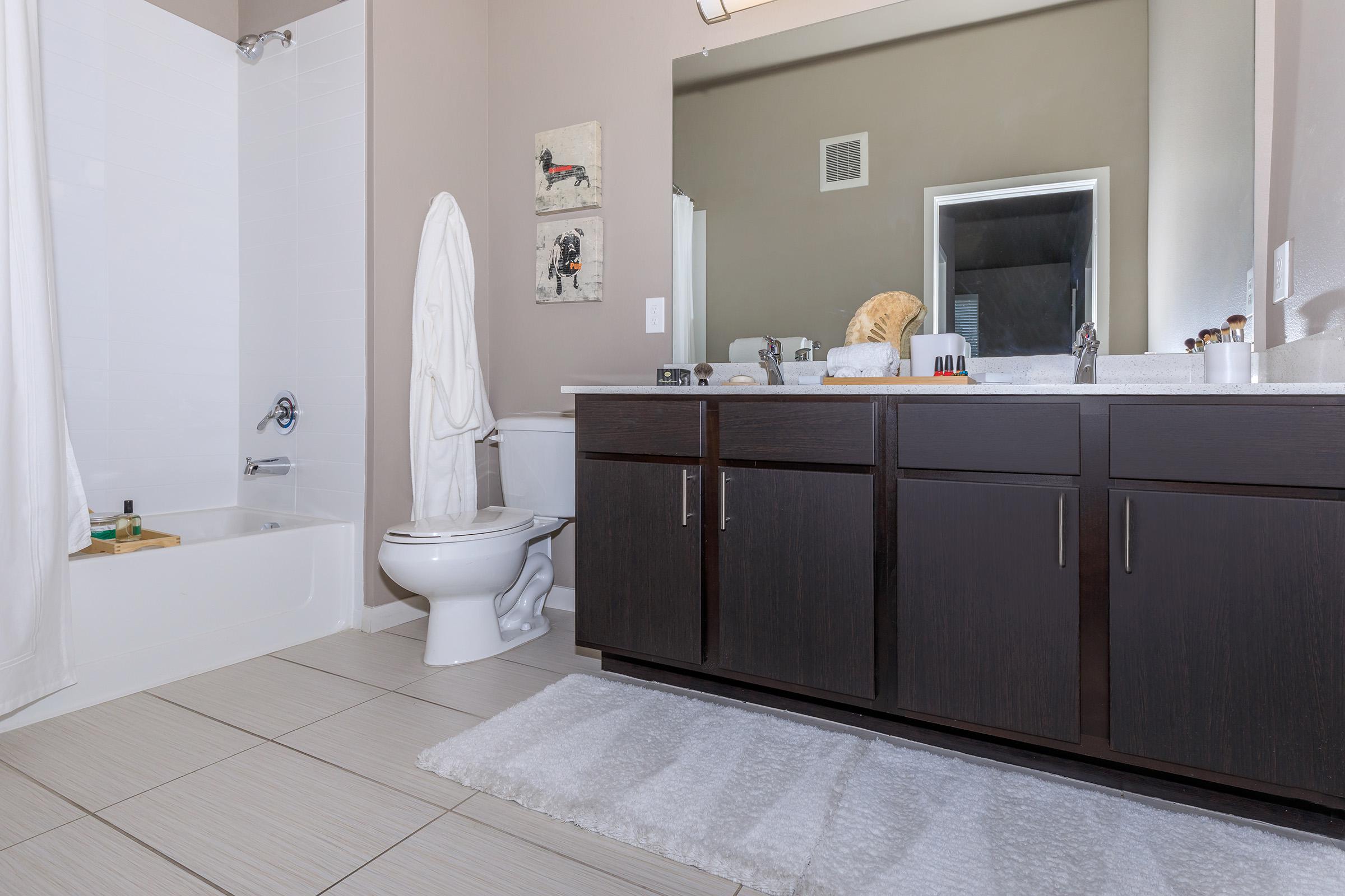 a room with a sink and a mirror