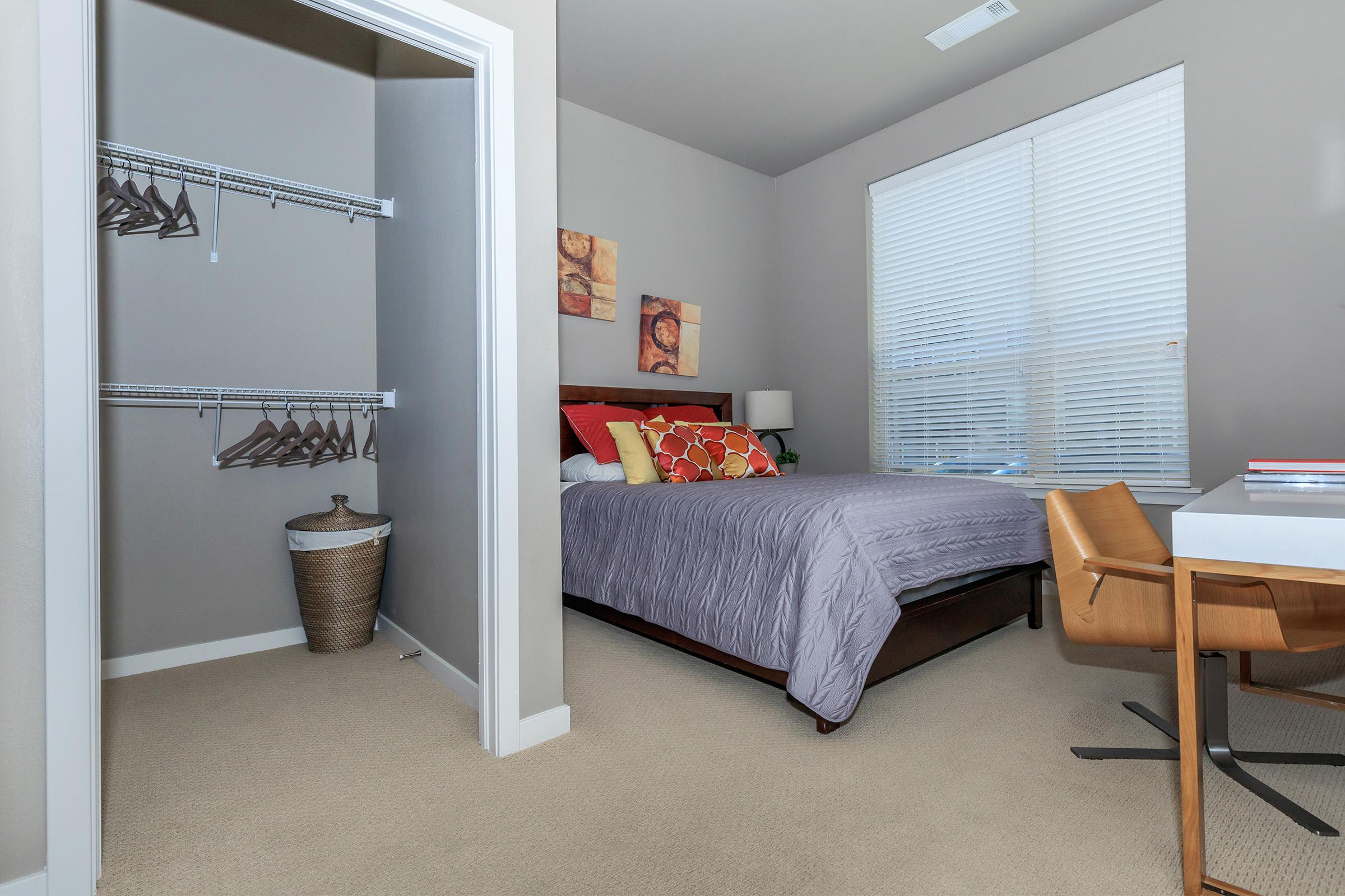 a room filled with furniture and a large window