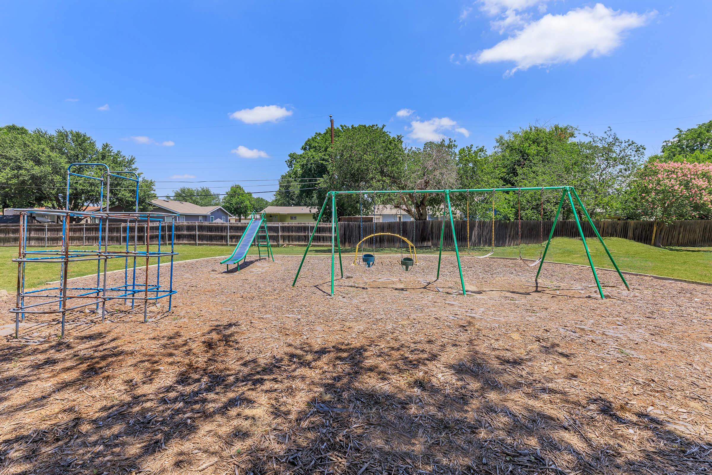 a playground in a dirt field