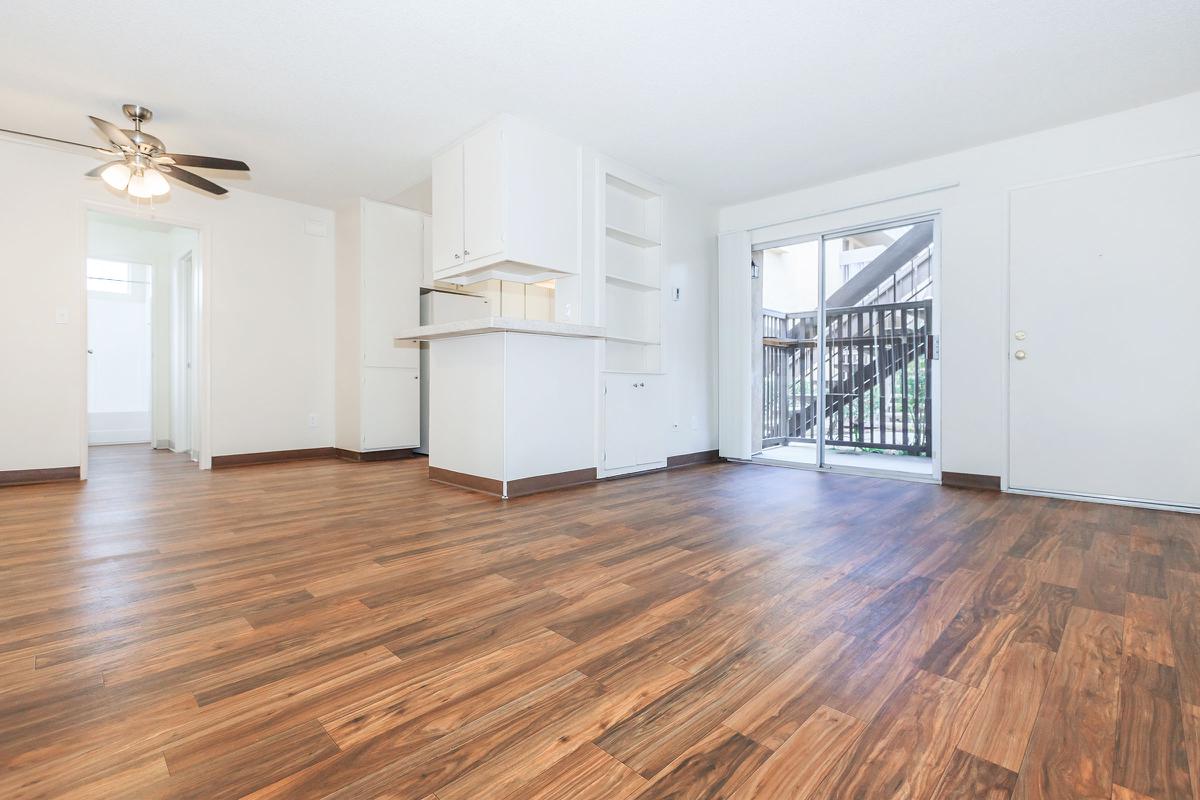 a large empty room with a wood floor