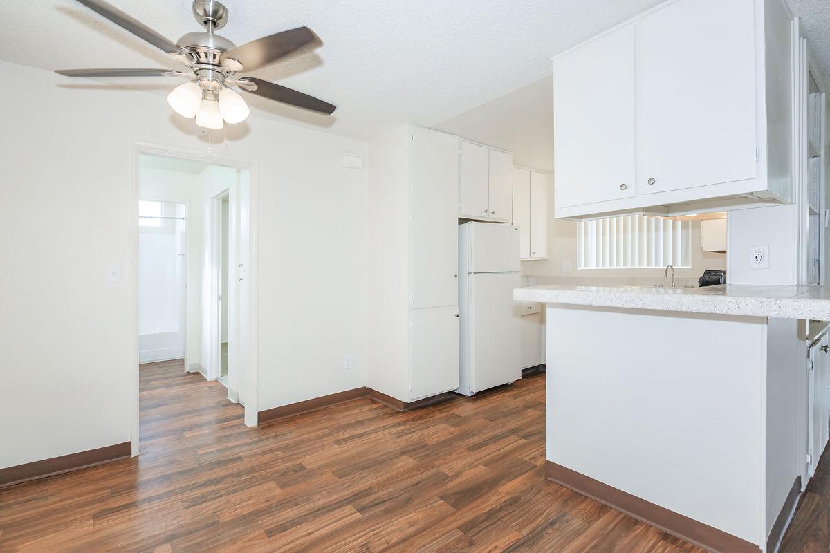 a kitchen with a wooden floor