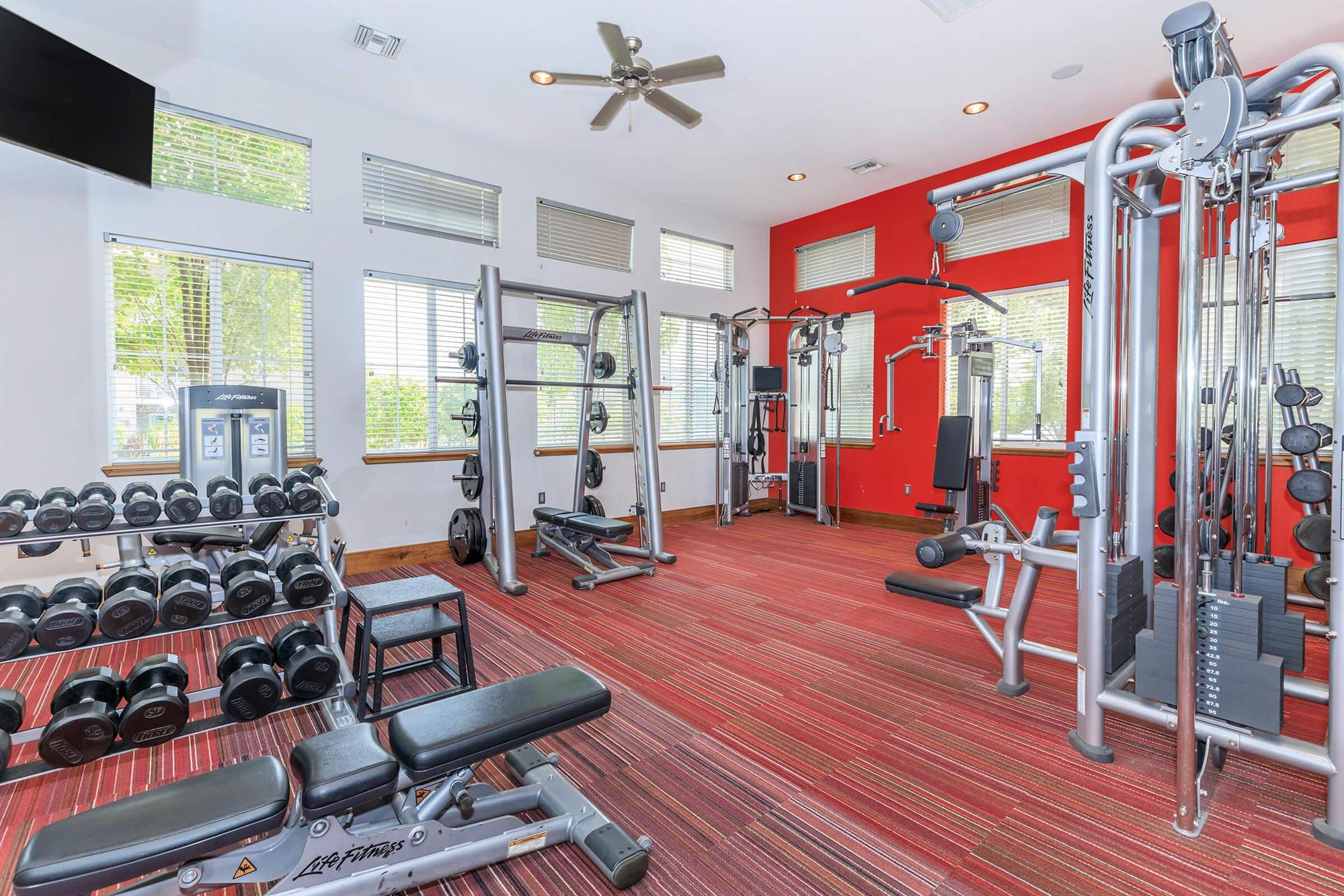 a room filled with furniture and a large window