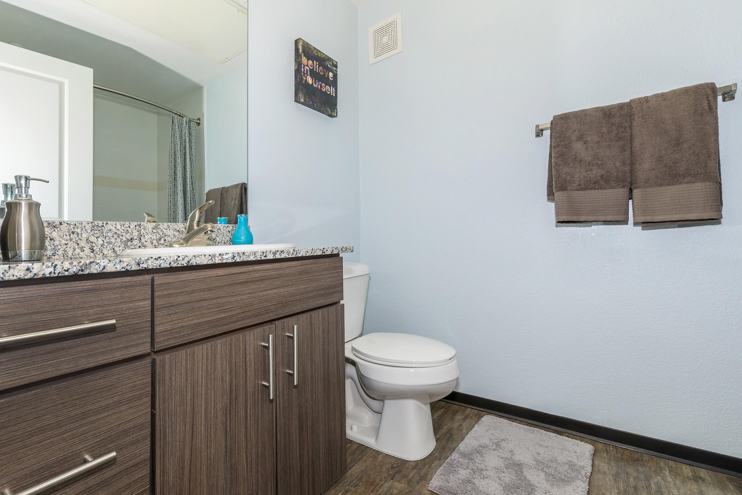 a room with a sink and a mirror