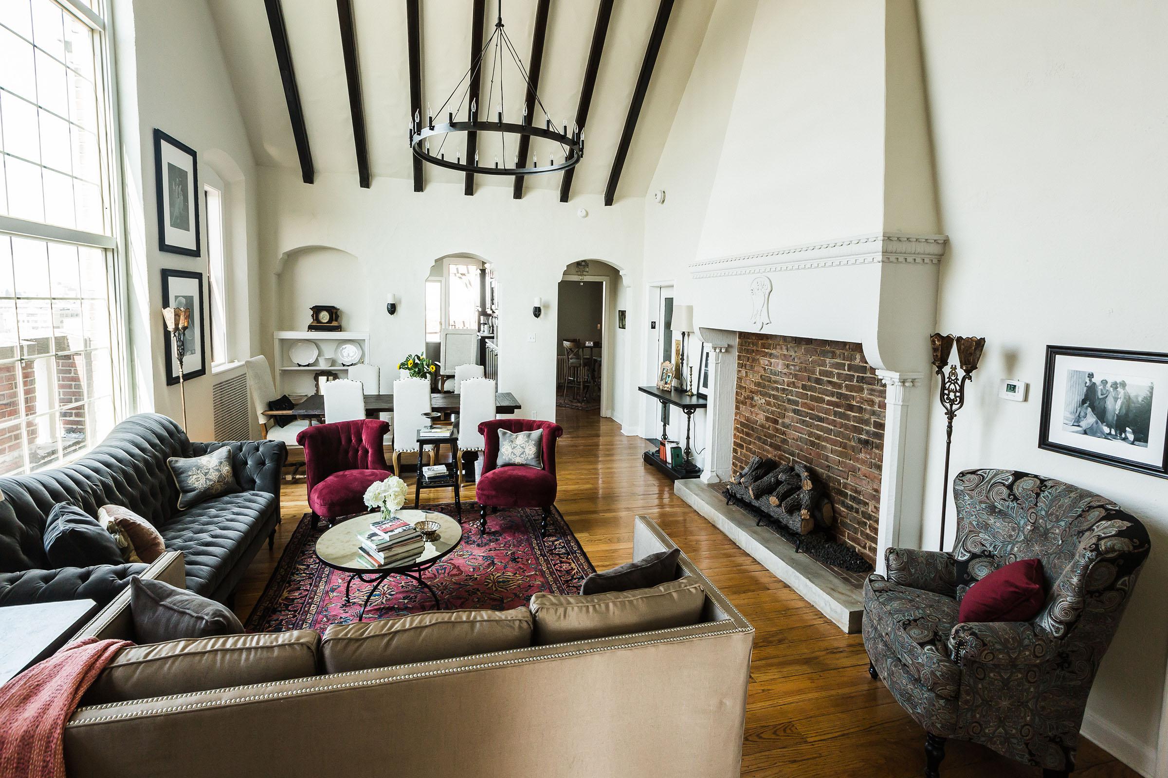 a living room filled with furniture and a fireplace