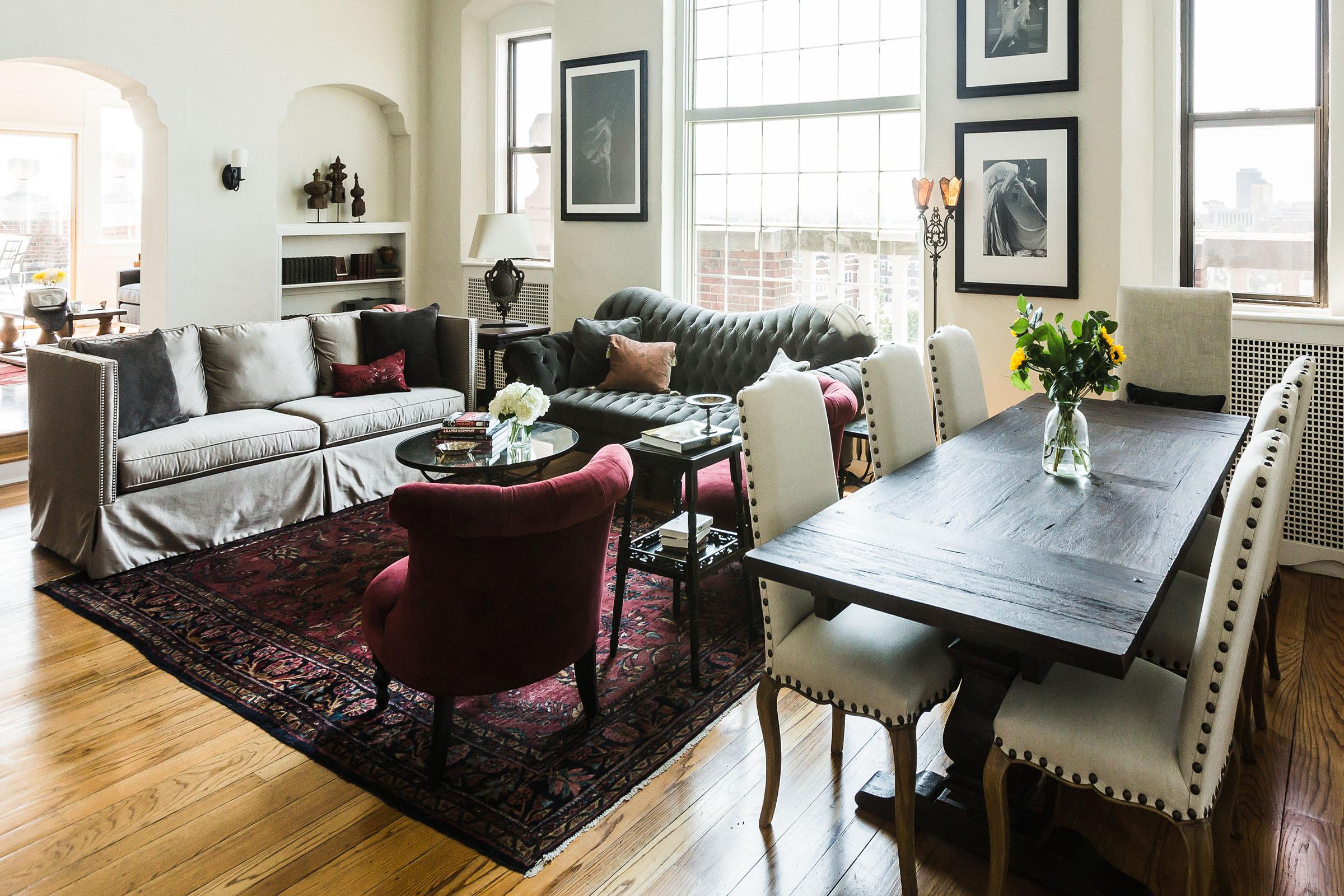 a living room filled with furniture and a window