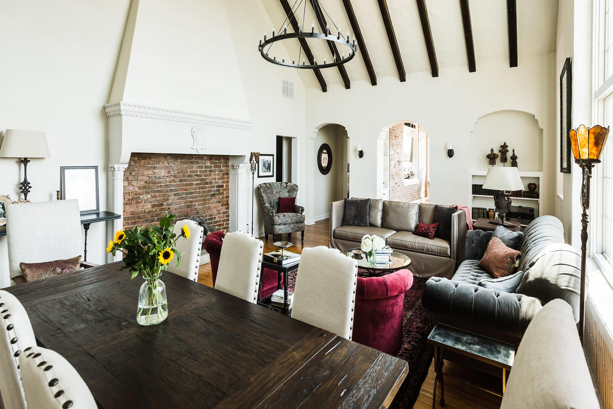a living room filled with furniture and a fireplace