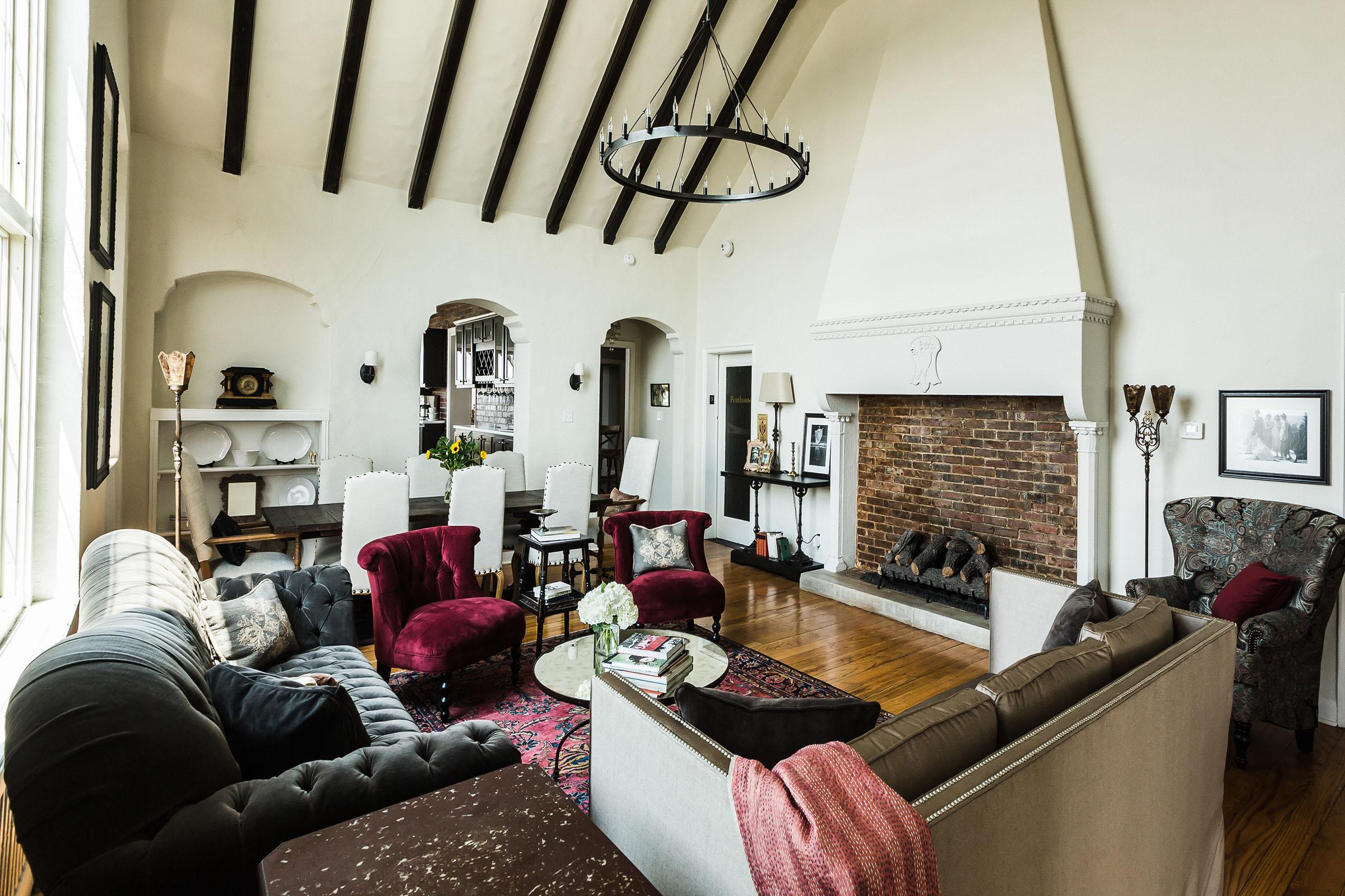 a living room filled with furniture and a tv