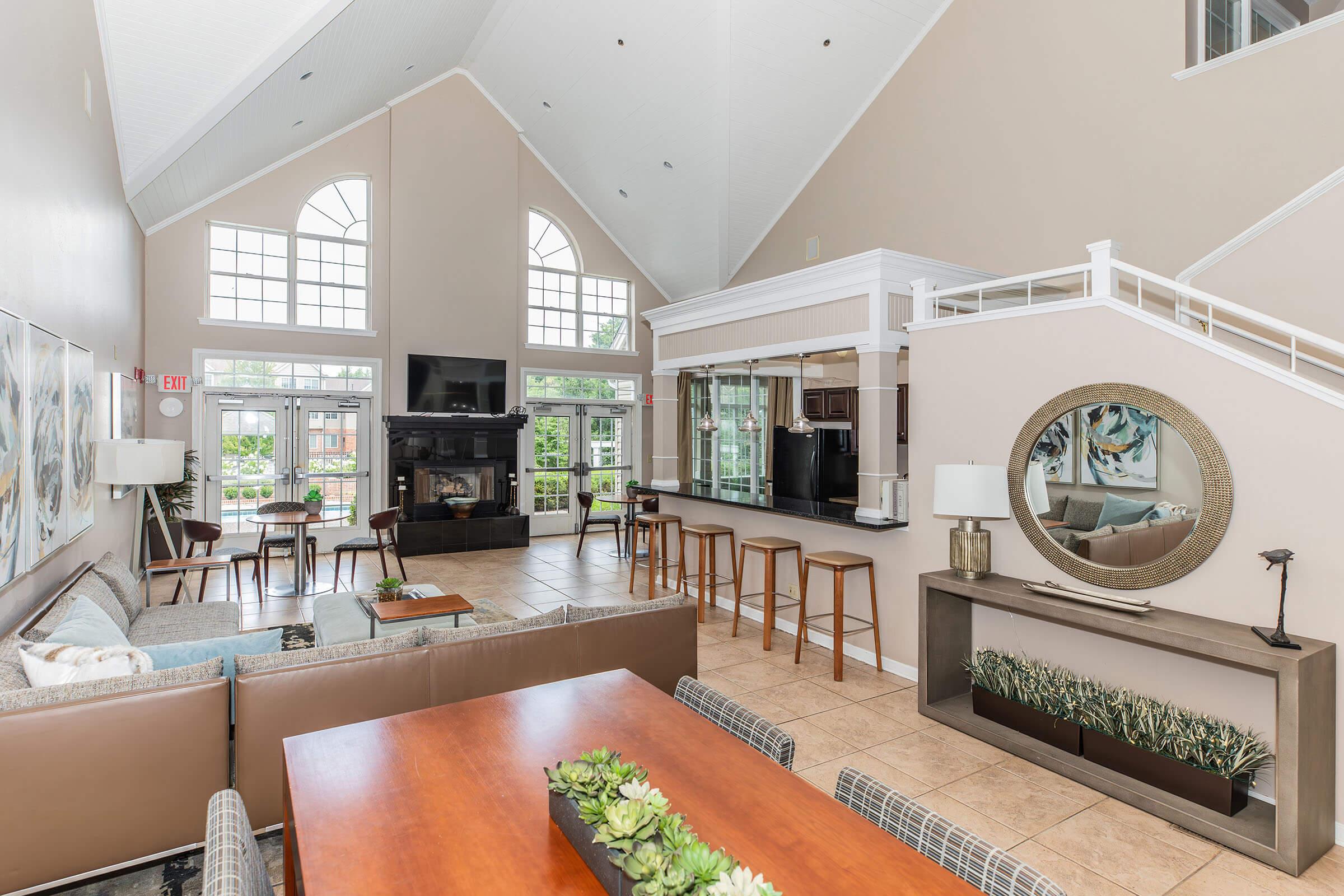 a living room filled with furniture and a large window