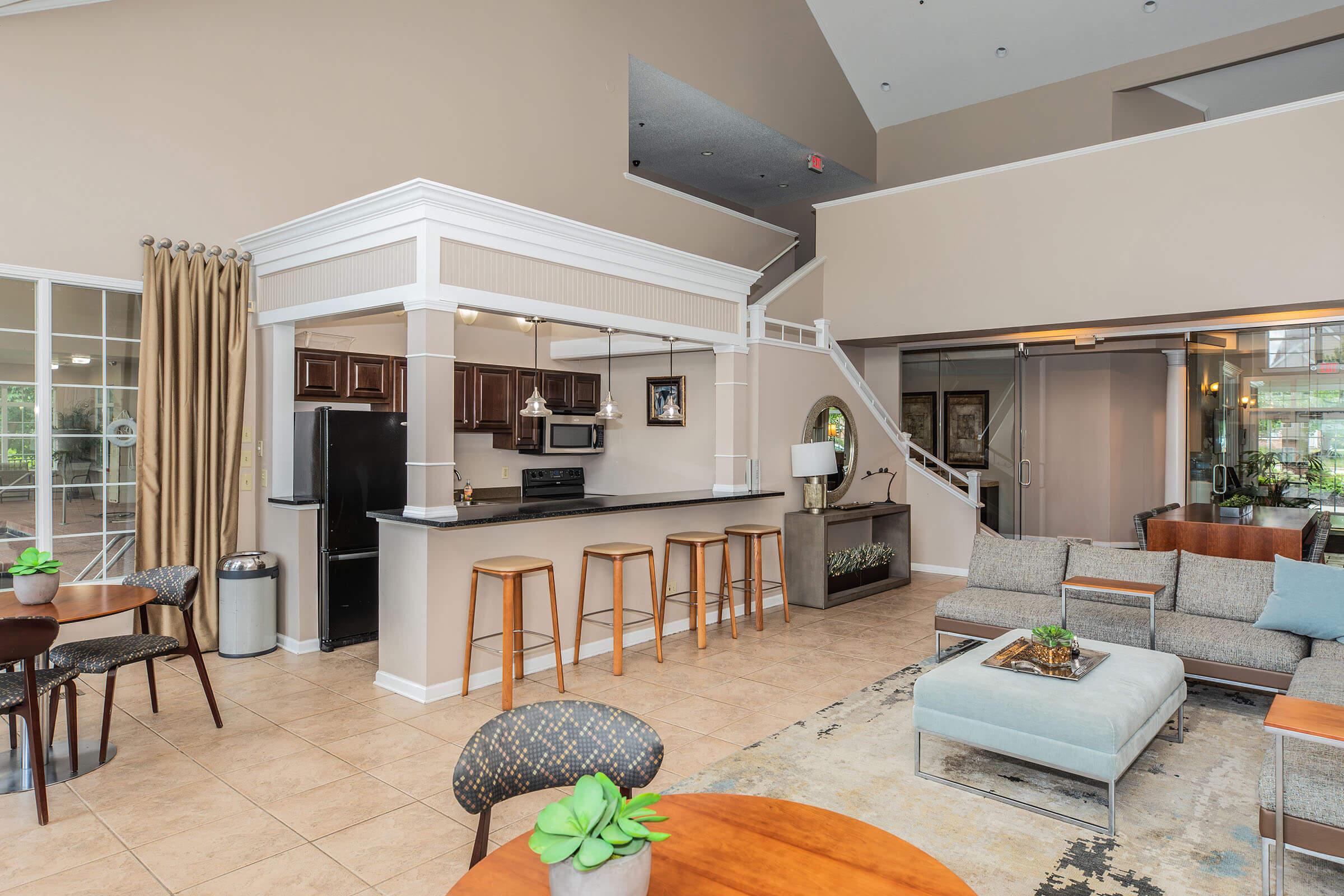 a living room filled with furniture and a fireplace