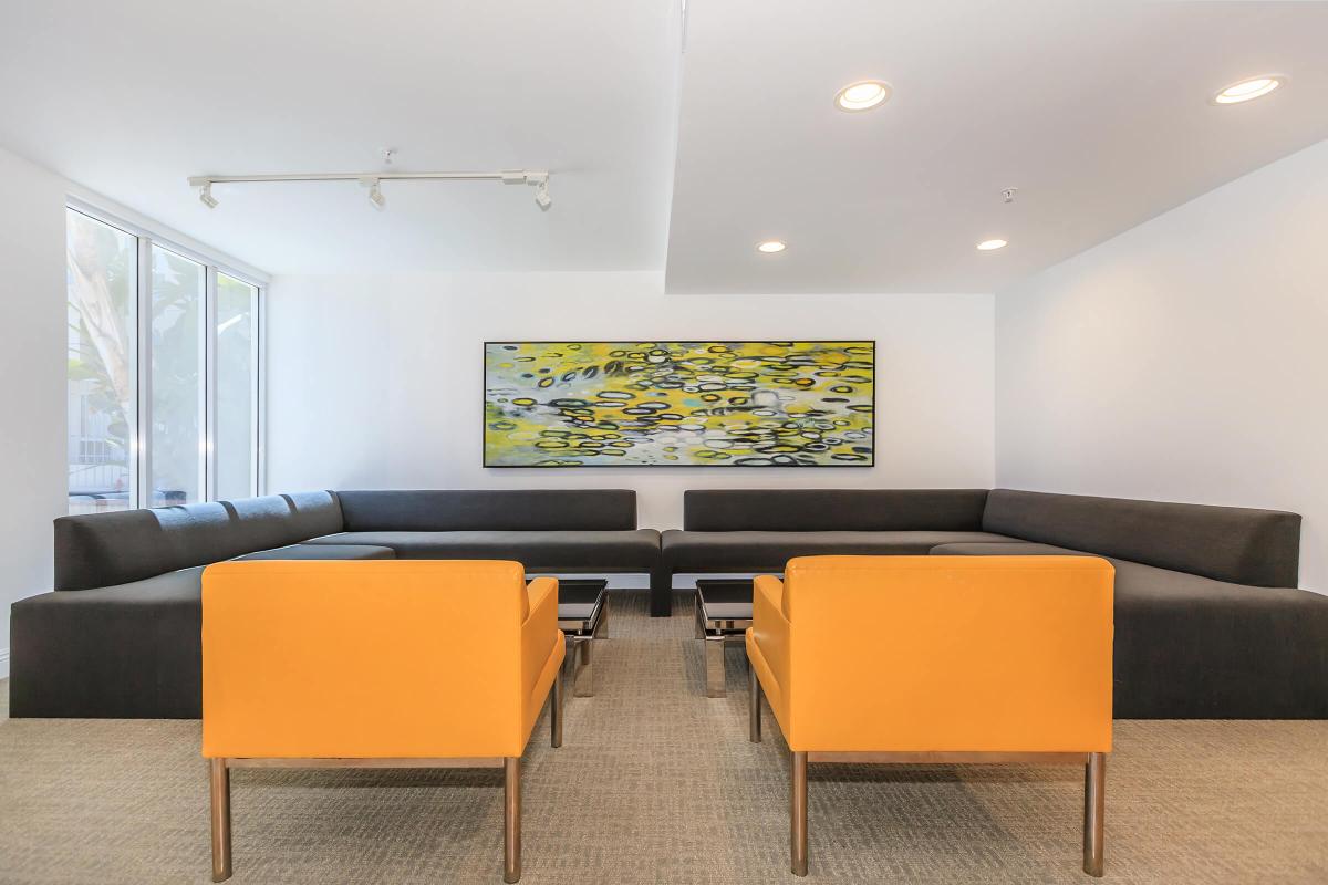 a living room filled with furniture and a flat screen tv