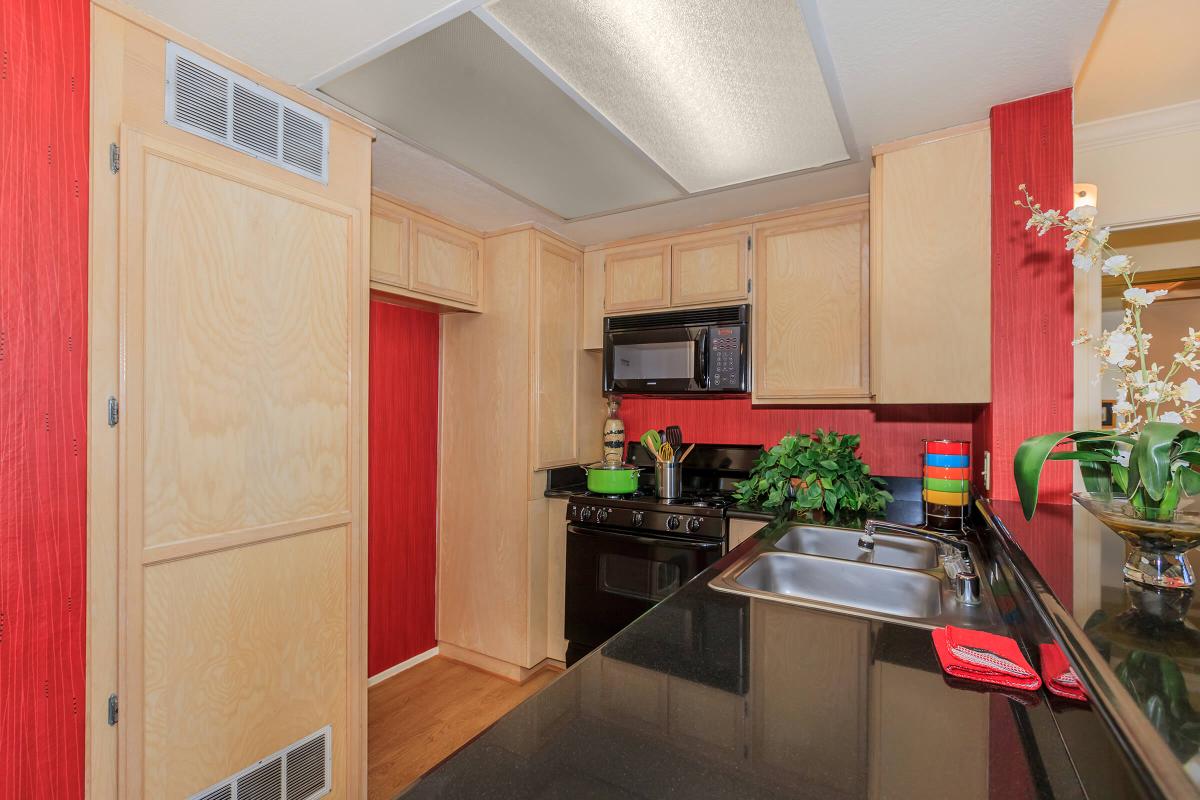 a kitchen with a sink and a microwave