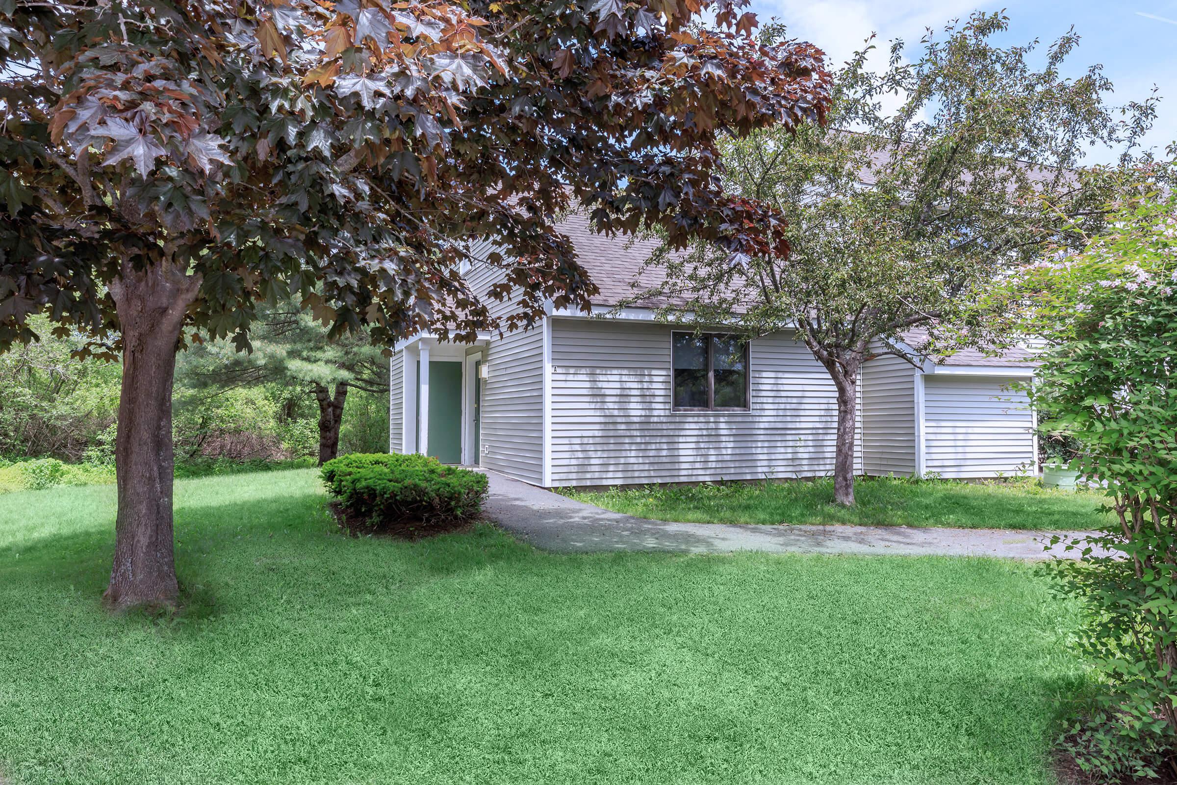 a large lawn in front of a house