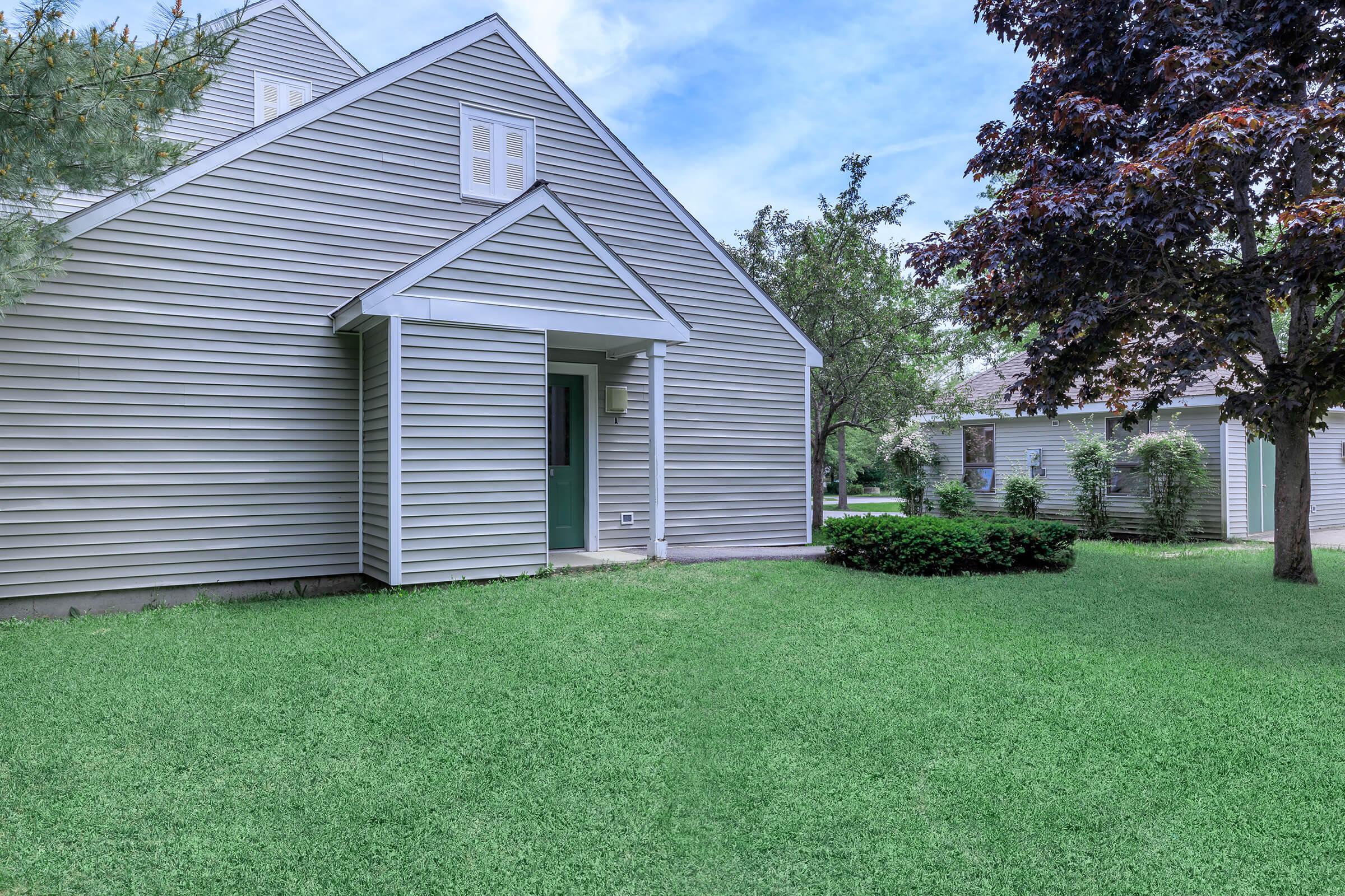 a large lawn in front of a house