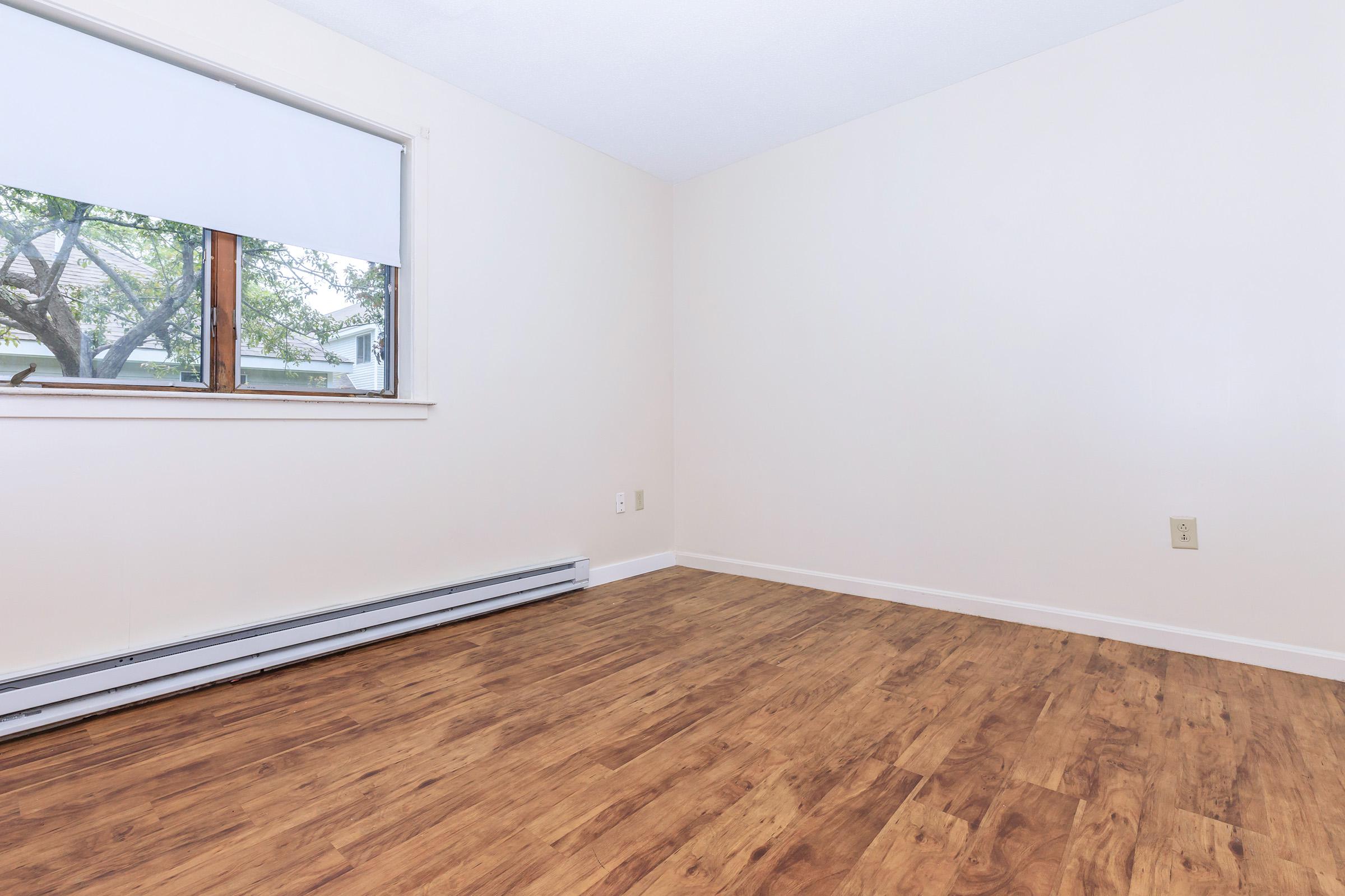 a bedroom with a large window