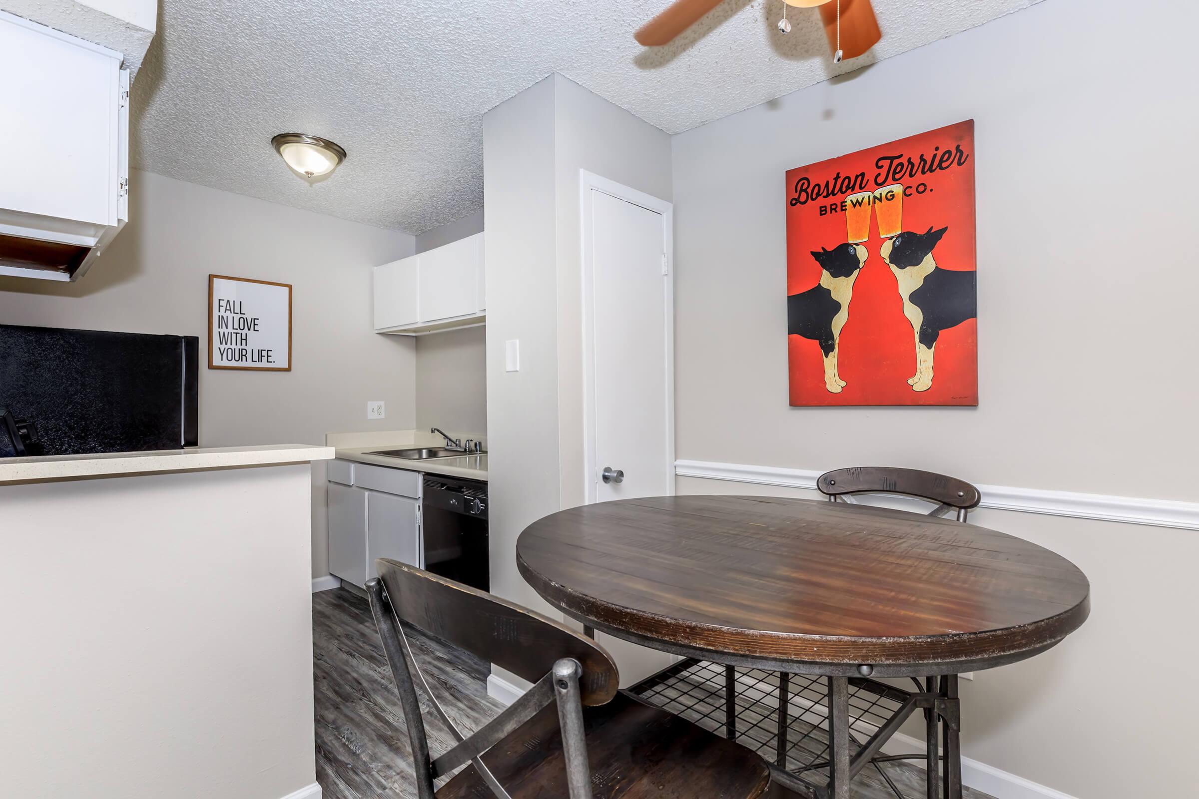 a kitchen with a table in a room