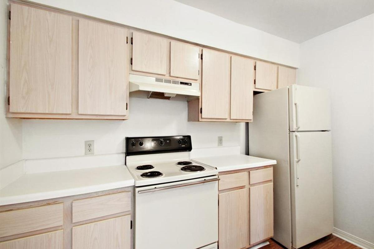 a kitchen with a stove top oven sitting inside of a refrigerator