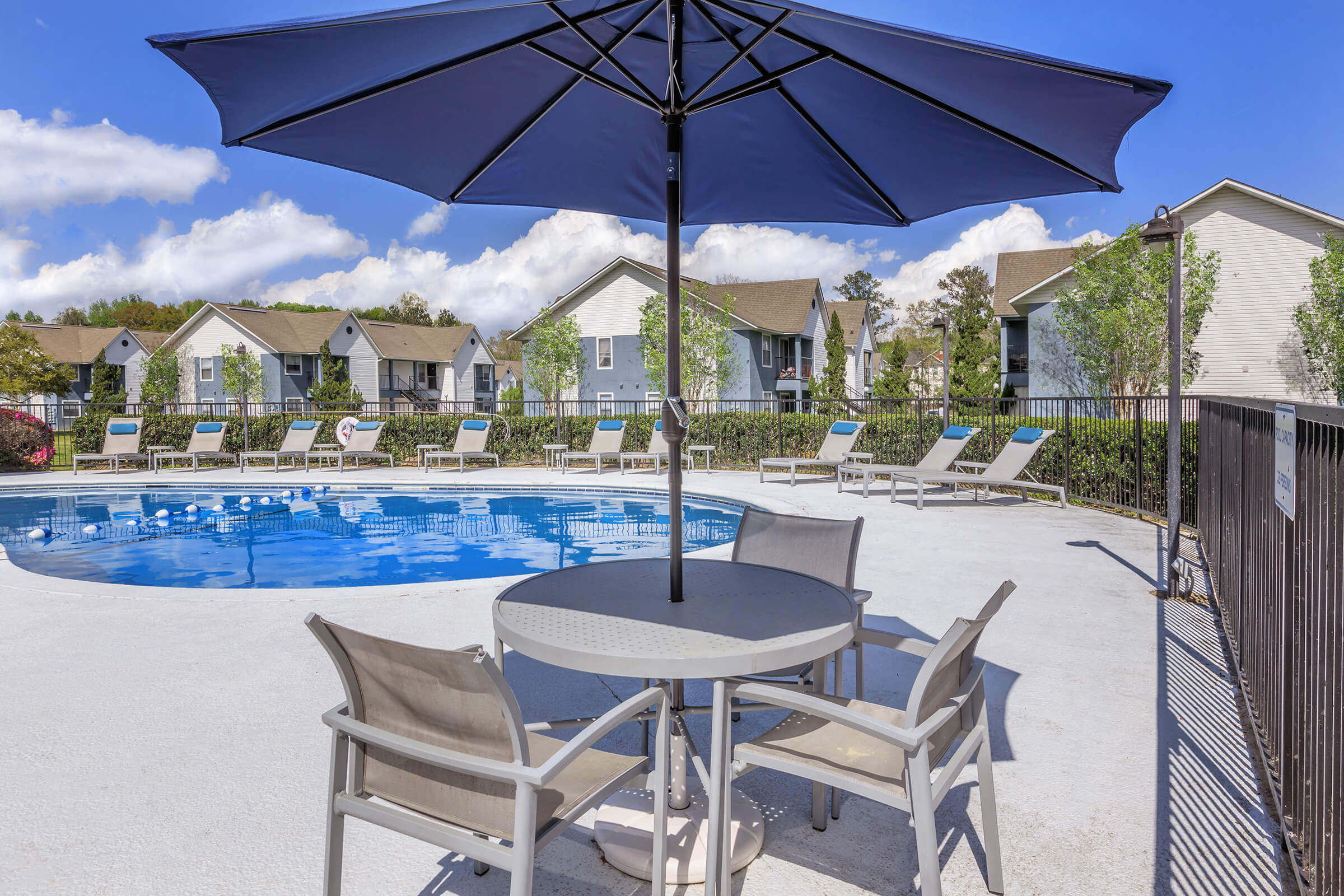 a lawn chair under an umbrella